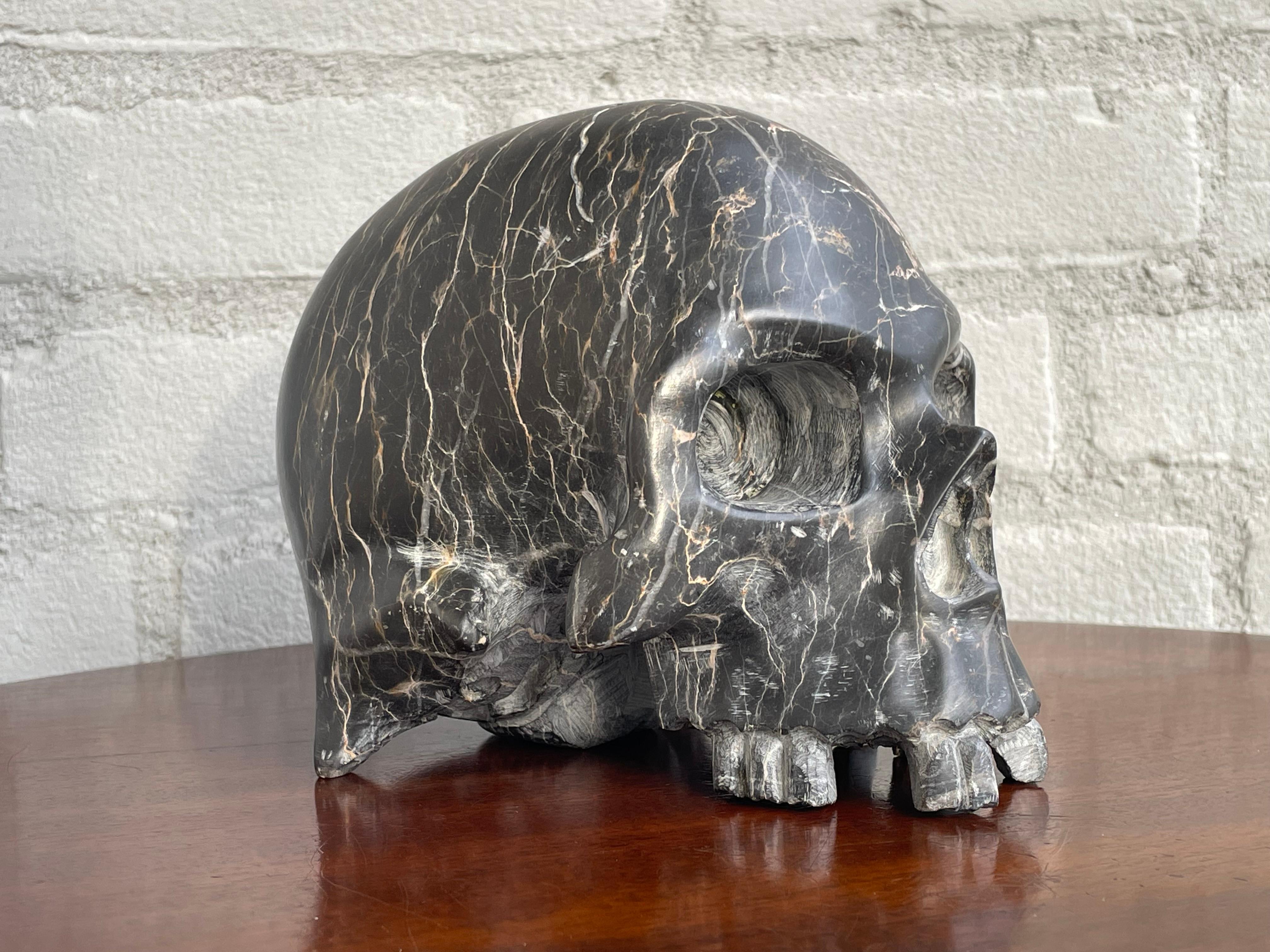 Practical size and perfectly handcrafted marble skull.

Skulls of all kinds of creatures have always been collected and since it is ever more difficult to own a real human skull (for good reasons) this practical size marble one certainly is the next