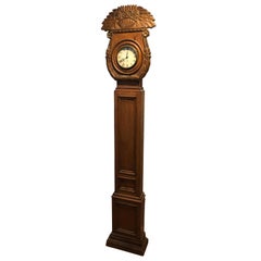 Rare horloge de parquet Chapman en bois sculpté