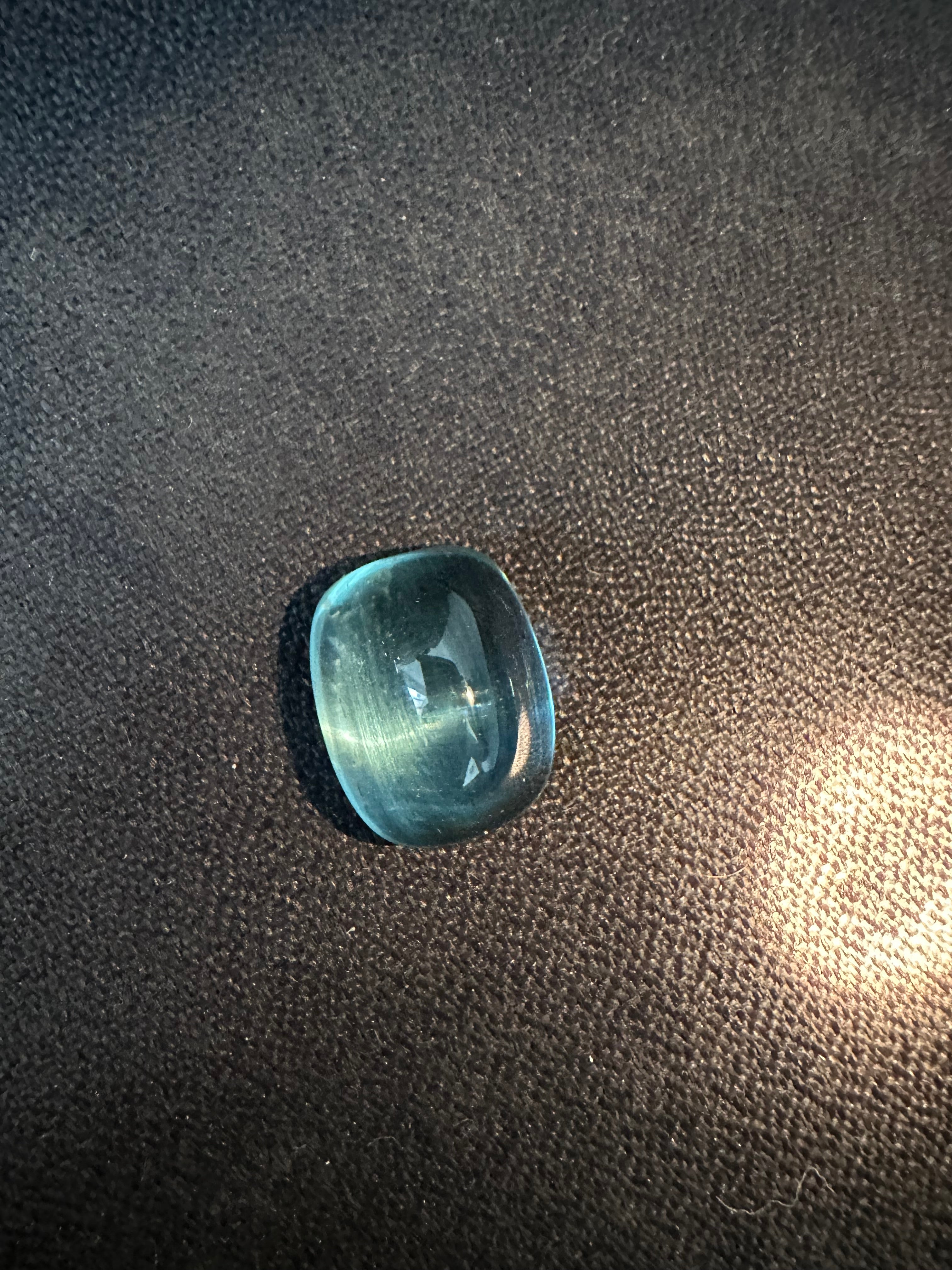 Fine needles inclusion in the stone oriented in a way to showcase a cats eye phenomenon when a direct overhead light is spotted.
Weight: 22.84 Carats
Size: 19x15 MM
Pieces: 1