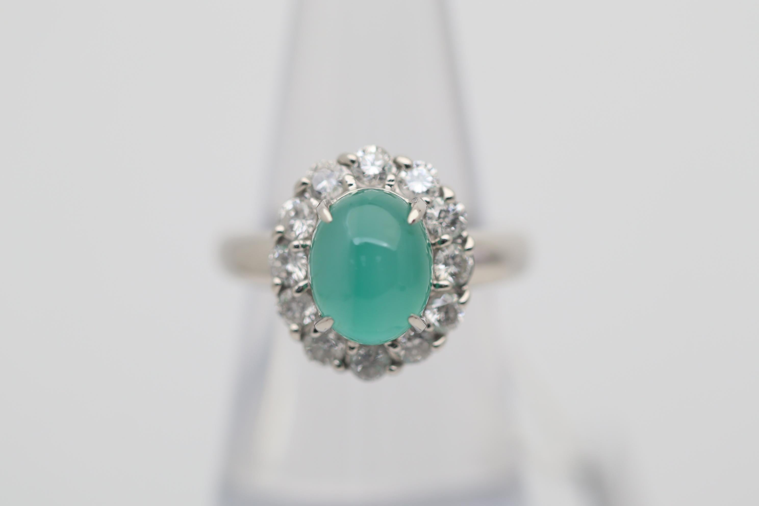 A special piece for a true lover of fine gemstones. This ring features a 3.85 carat emerald which has a cats eye effect! Rare for emeralds, this eye can be seen running down the stone as a direct light hits it. Adding to that the stone has an even