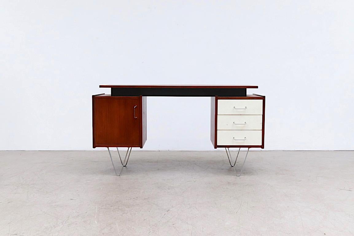 Mid-century desk by Cees Braakman for Pastoe with Fat Hairpin Legs, This Version has a Left Hand Cabinet with Pull out Shelves a Set of White Painted Stacking Drawers on the Right side under a Floating Top. Chair opening is 23.5