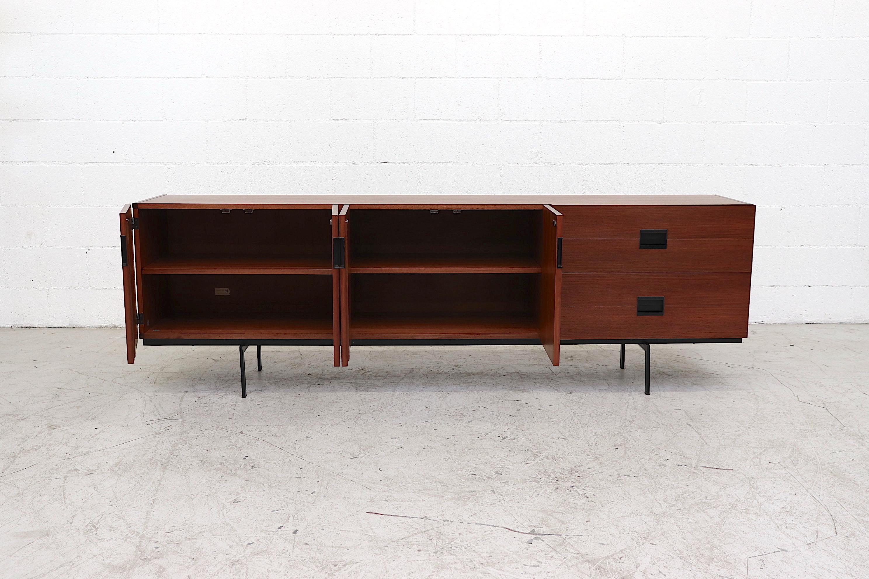 Rare Cees Braakman Japanese series model DU03 teak credenza by Cees Braakman for UMS Pastoe with square inset acrylic handles, signature curve birch drawer interiors and black enameled metal base. In good original condition with wear consistent with