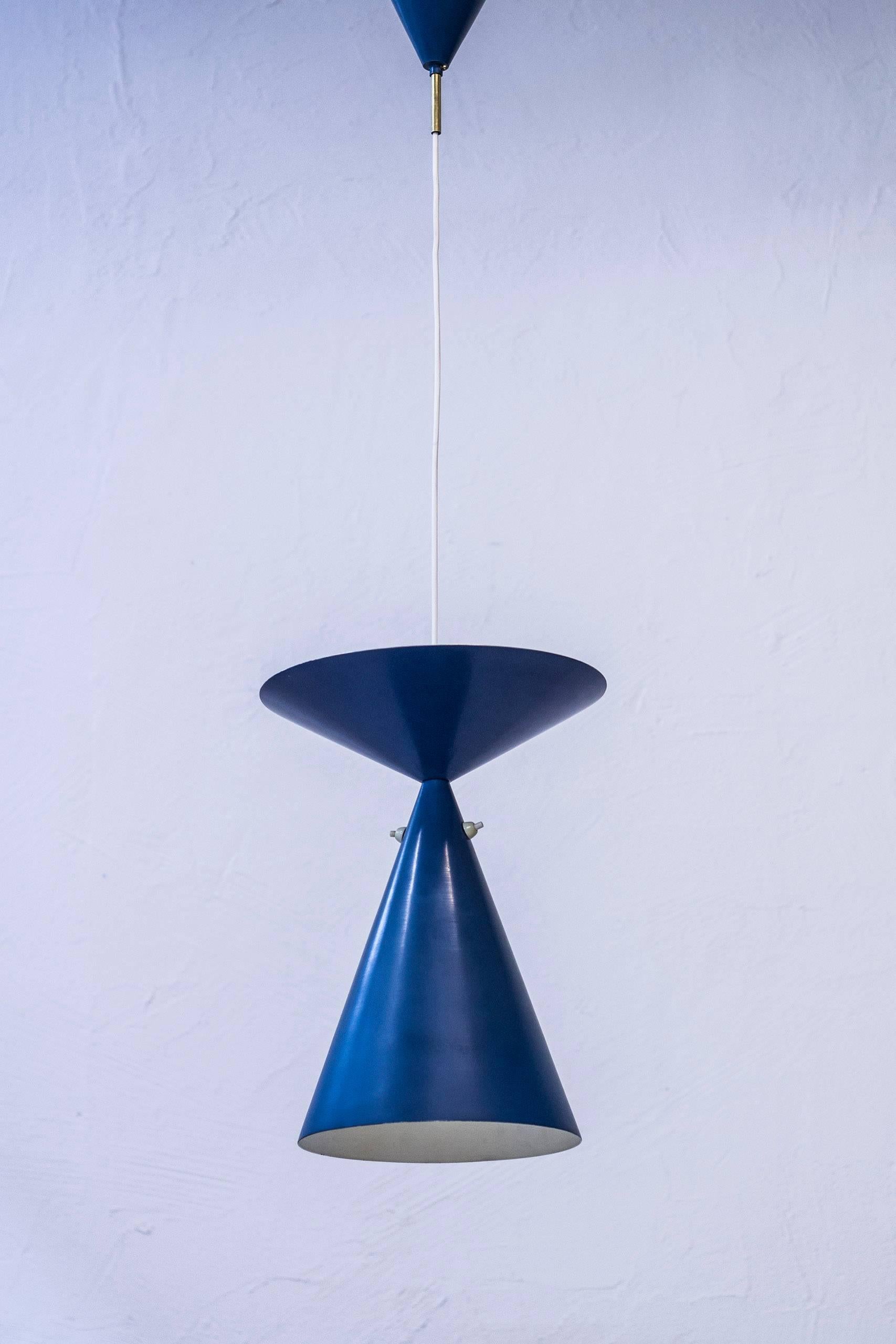 Rare ceiling lamp designed by Bertil Brisborg. Designed and Produced, circa 1950 in very limited quantities. Produced by Nordiska Kompaniet. Blue lacquered up and down light with light switches on the down light shade for varying the light according