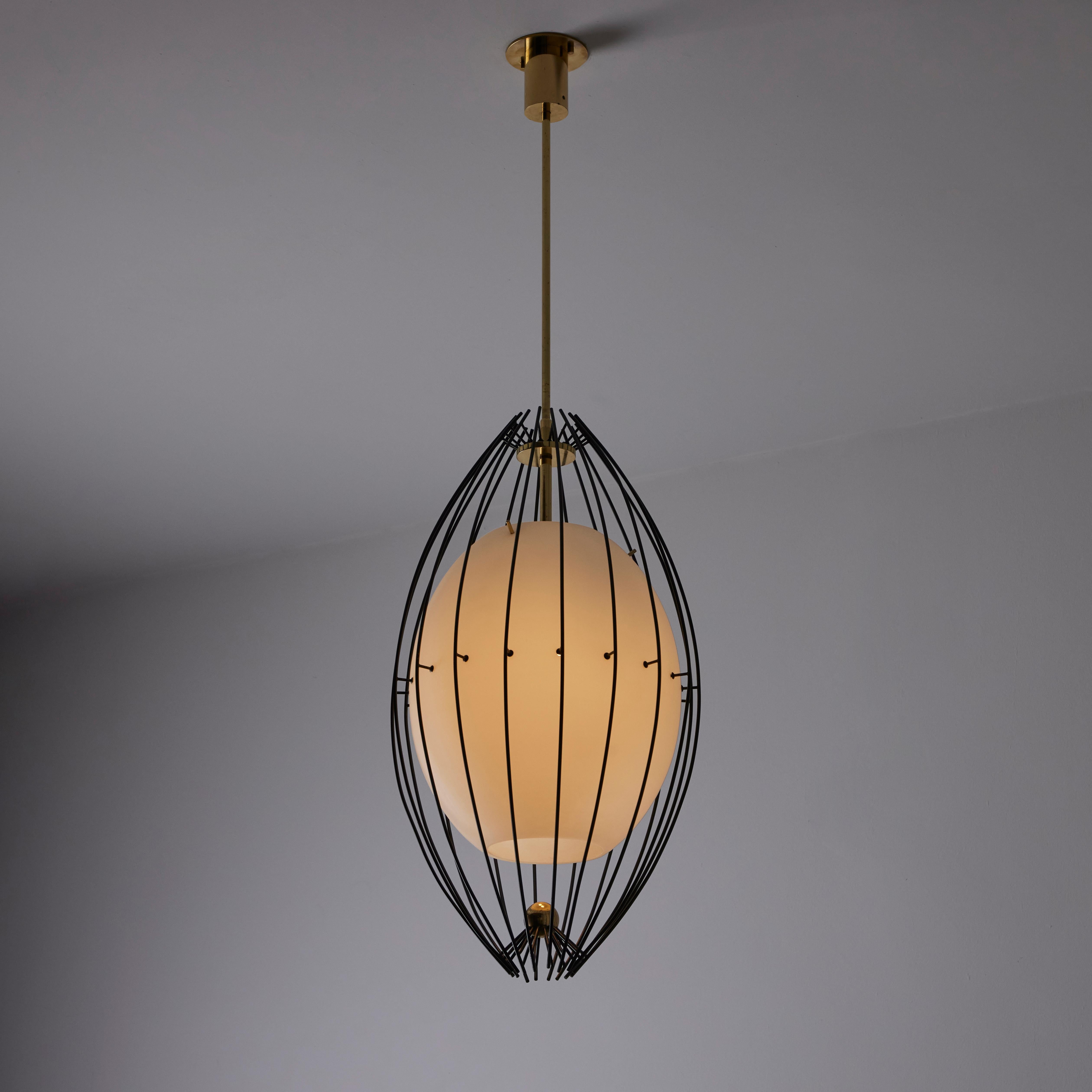 Rare ceiling light by Angelo Lelii for Arredoluce. Designed and manufactured in Italy, in 1958. An oval glass orb is caged by enameled rods throughout the body of this pendant. The rods are black enameled and there are polished brass details at the