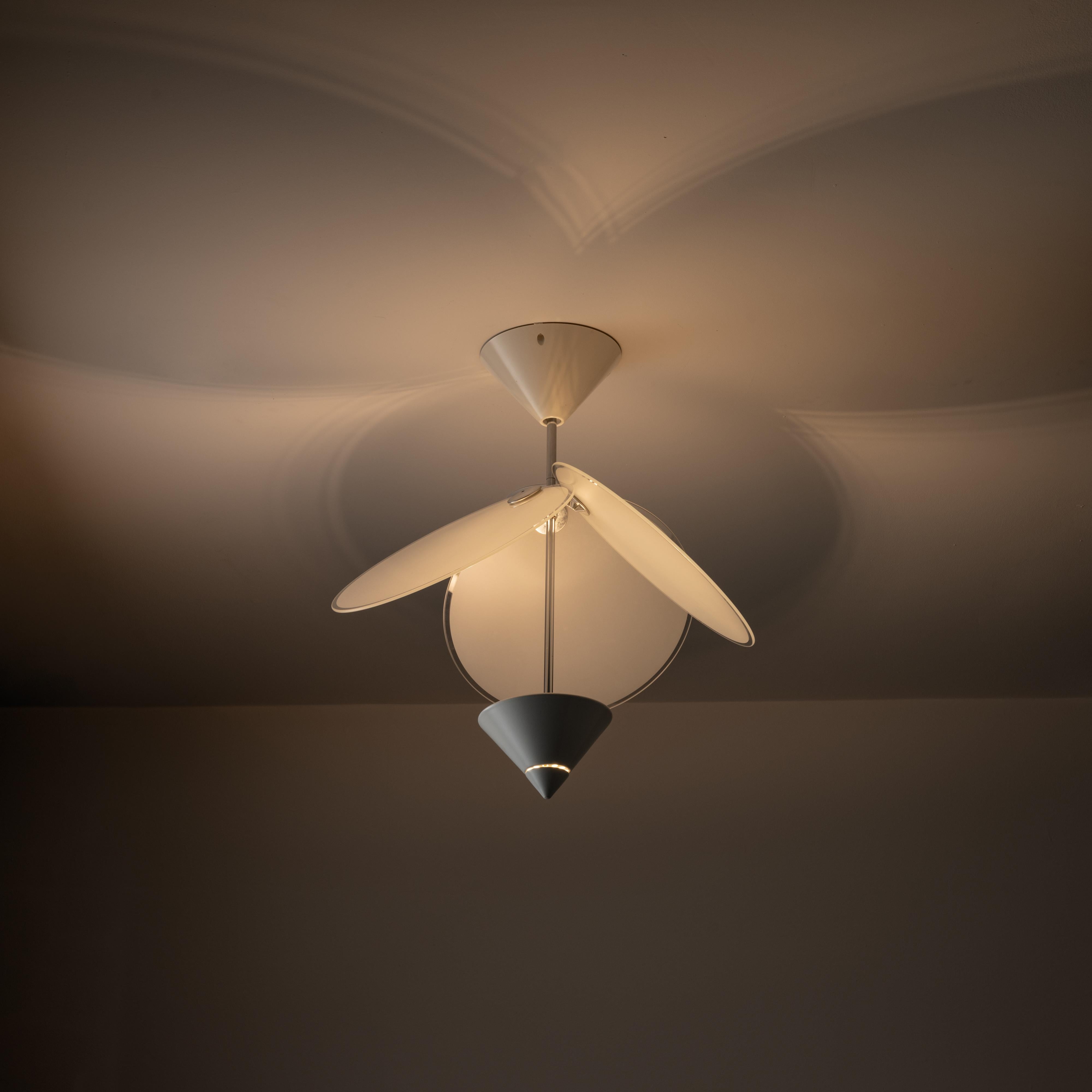 Rare ceiling light by Vico Magistretti for Oluce. Designed and manufactured in Italy, circa the 1980s. Striking contemporary piece. Three large sandblasted glass discs cantilever over a simplistic straight-formed fixture body. Each disc has an outer