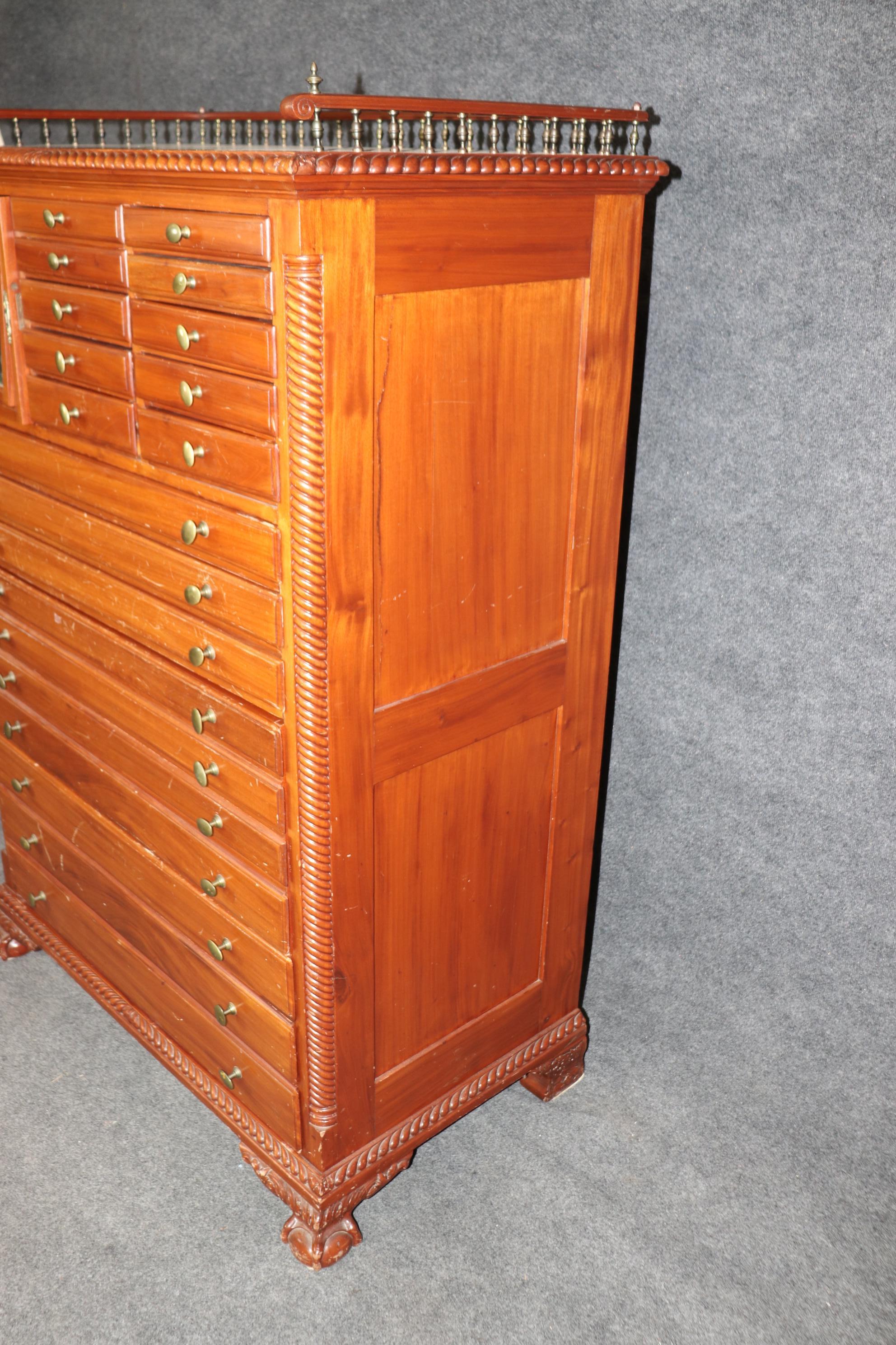 This is a very unique piece, a true curiosity if you will. The cabinet is designed in the Centennial period 100 years after the USA's independence from Britain in 1776. The carving is unmistakably Chippendale and carved to look like the pieces of