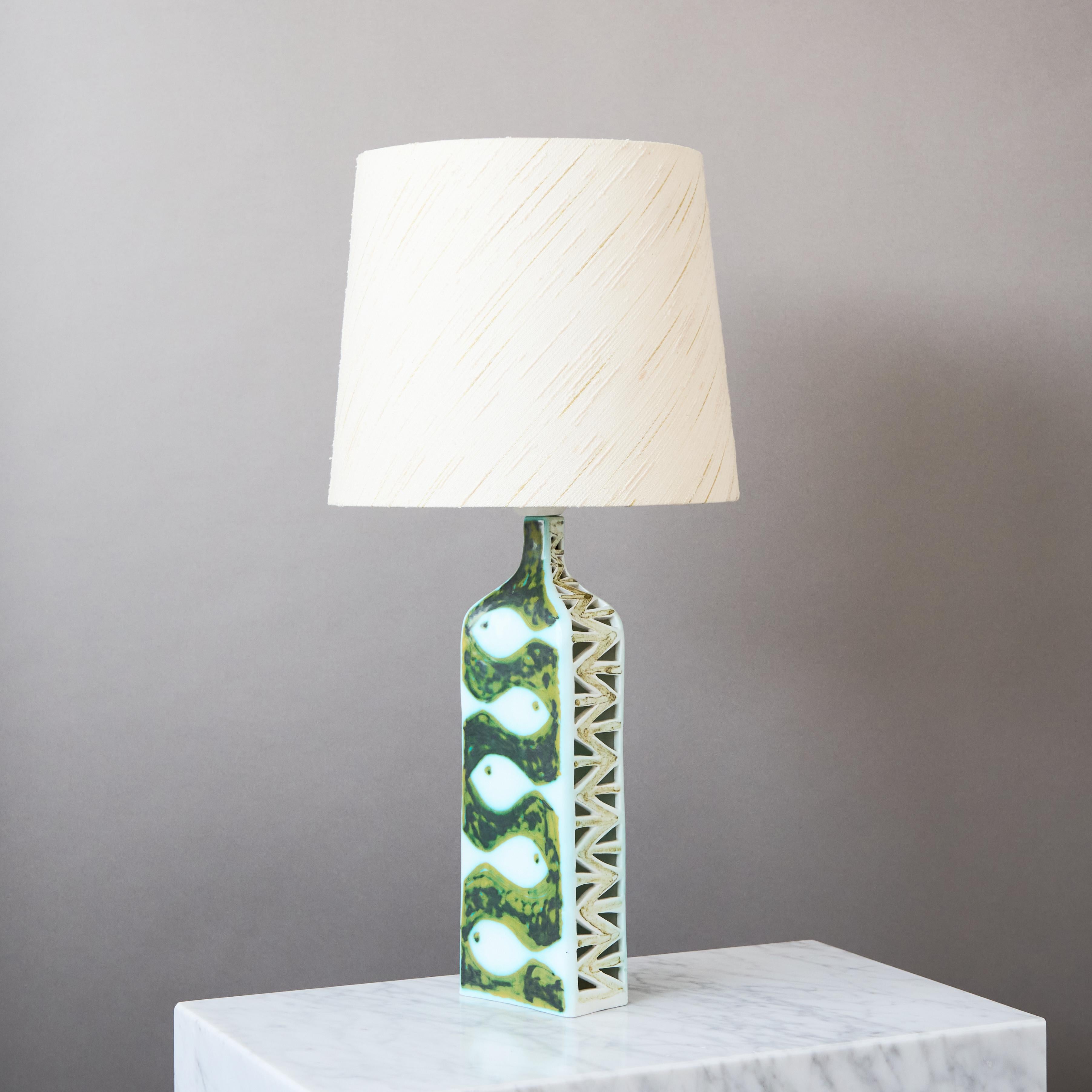 Rare ceramic table lamp, decorated with the shapes of white fish on one side and a man on the other.
Made by renowned Italian sculptor and ceramist Alessio Tasca 1960.

Excellent original condition. 
Singed 'Tasca Italy 1960'.

Sold without
