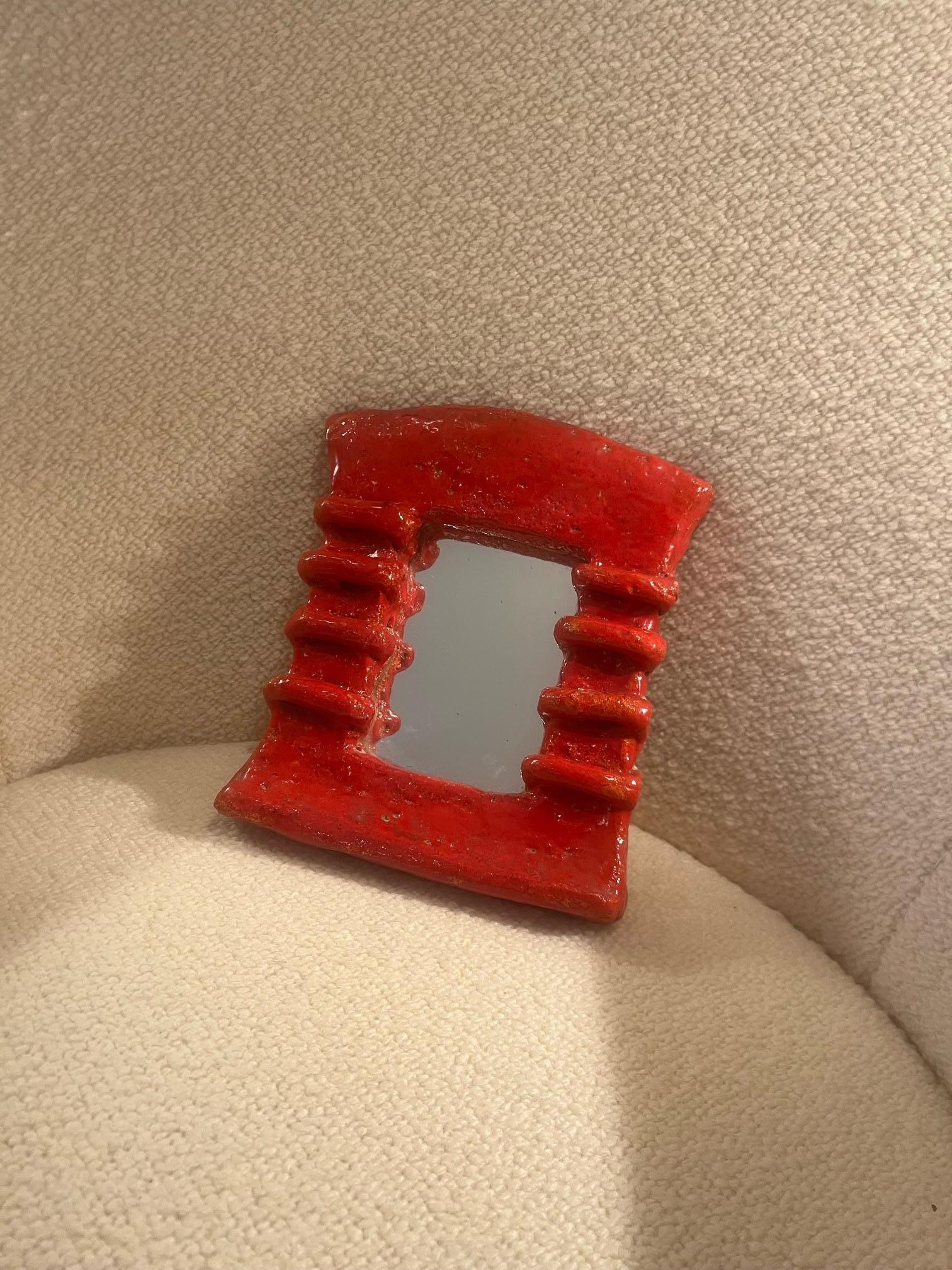 Ceramic mirror by Les Argonautes
1960's
Signed on the back