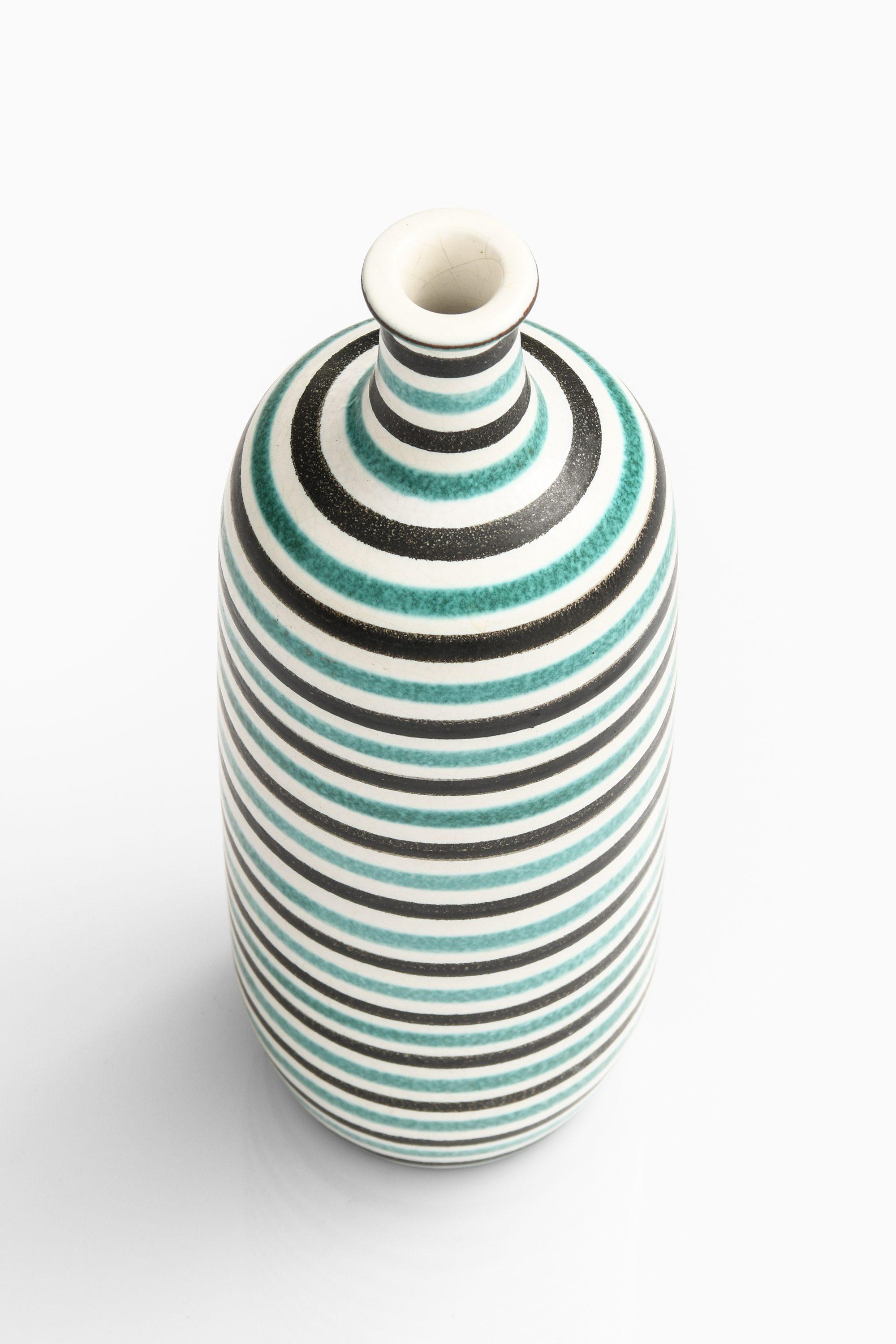 Rare Ceramic Vase in Blue by Stig Lindberg, 1950’s

Additional Information:
Material: Ceramic
Style: Mid century, Scandinavian
Produced by Gustavsberg in Sweden
Dimensions: (W x D x H): 10.5 x 10.5 x 30 cm
Condition: Good vintage condition, with