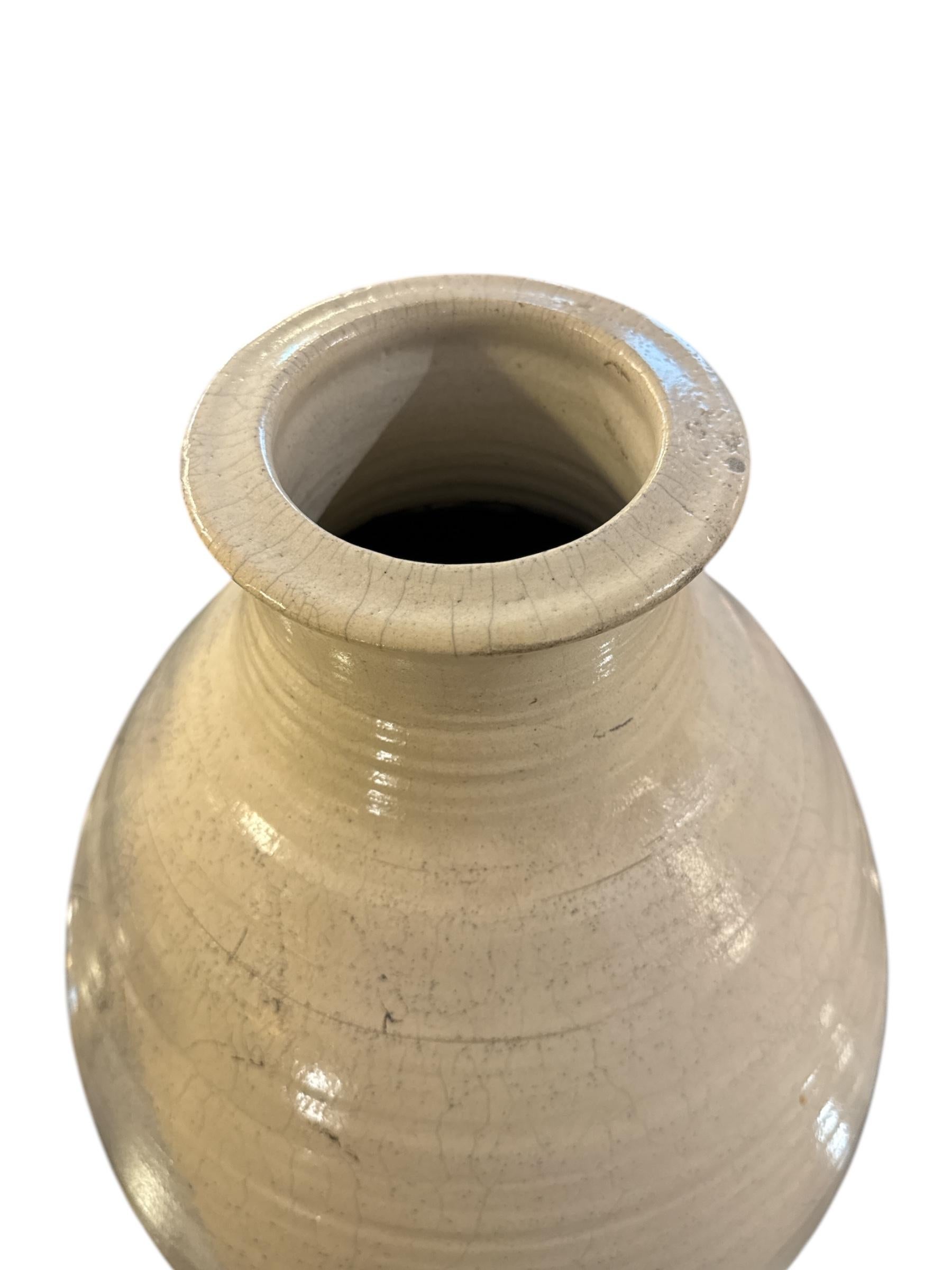 This Rare Ceramic Vase Signed by Scheller is a stunning piece of artisan craftsmanship, known for its unique design and exceptional quality. Featuring an open bottom that adds an intriguing element to the shape, this vase combines modernist flair