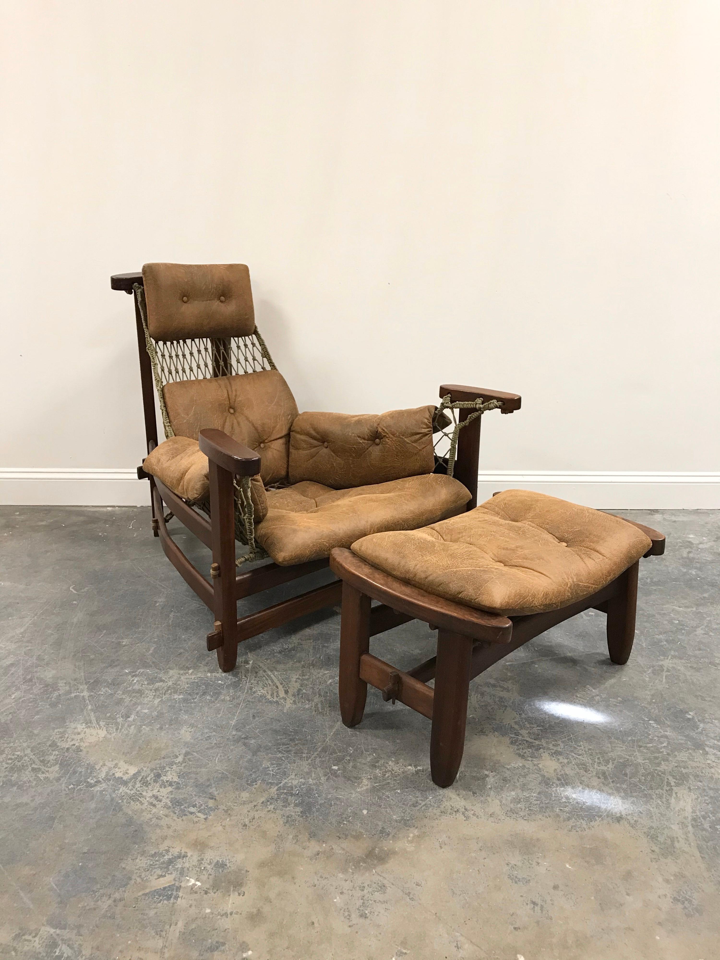 Excellent example of Brazilian Modernism. This Jean Gillon “Jangada” chair and ottoman is in wonderful condition. Chair features a Jacaranda wood frame, woven sling support net, and upholstered seating. Upholstery appears to be a synthetic suede