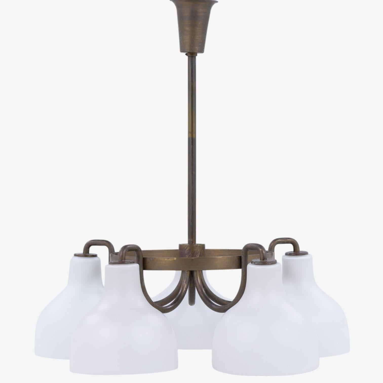 Chandelier in patinated brass with five individual glass shades. Designed by Vilhelm Lauritzen for Louis Poulsen.
