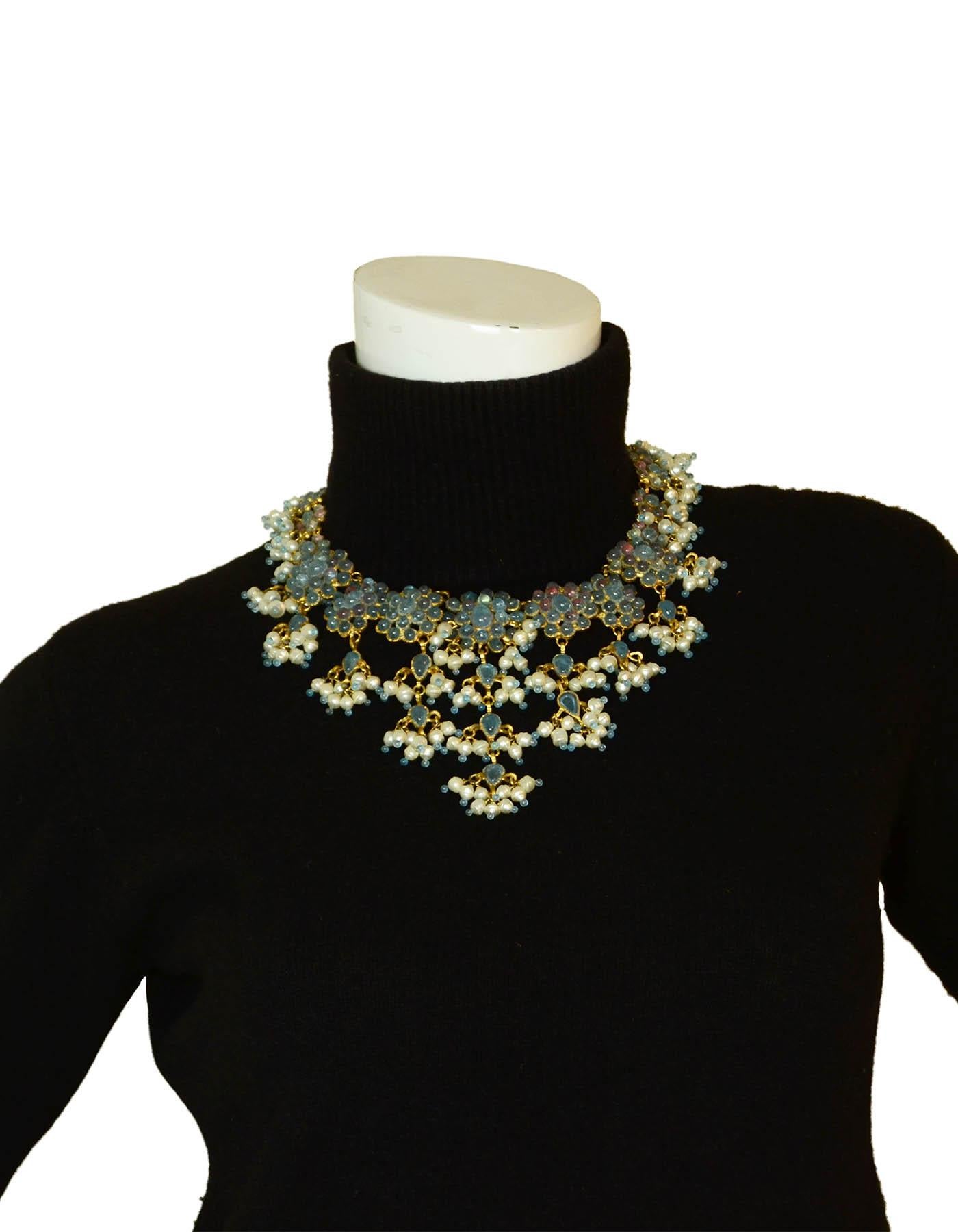 Rare Chanel 70’s Vintage Blue Gripoix & Faux Pearl Statement Necklace

Made In: France
Year of Production: 1990’s
Color: Blue
Materials: Gripoix and faux pearl
Hallmarks: Chanel stamp
Closure/Opening: Hook
Overall Condition: Excellent with the