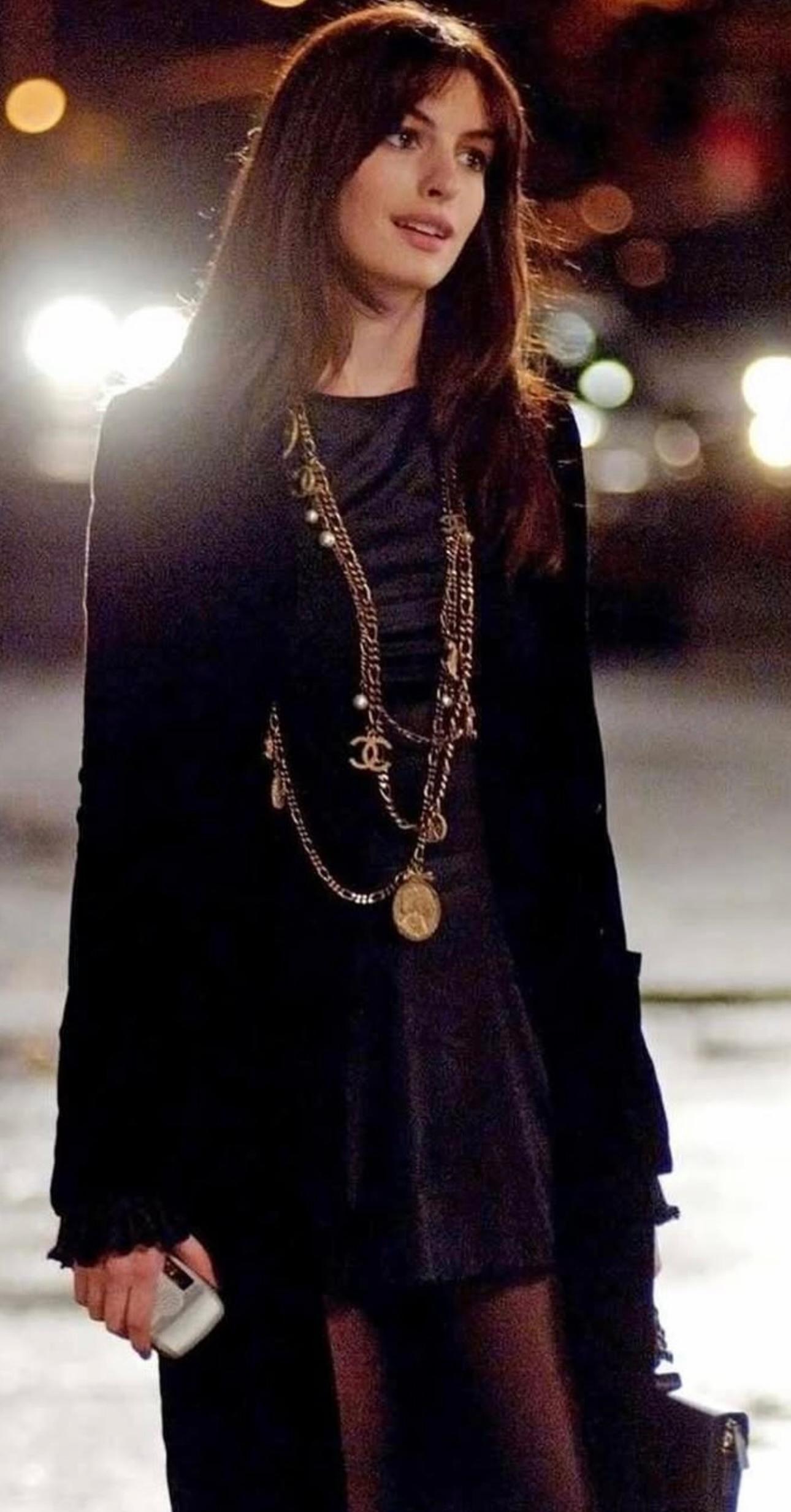 Rare Chanel 2005 collection multi strand long sautoir necklace as seen on Anne Hathaway in the devil wears Prada movie, bronze gold metal and faux pearls, coin with bow ribbon French quotes, Gabrielle Chanel. No stamp it’s a runway piece. Extremely