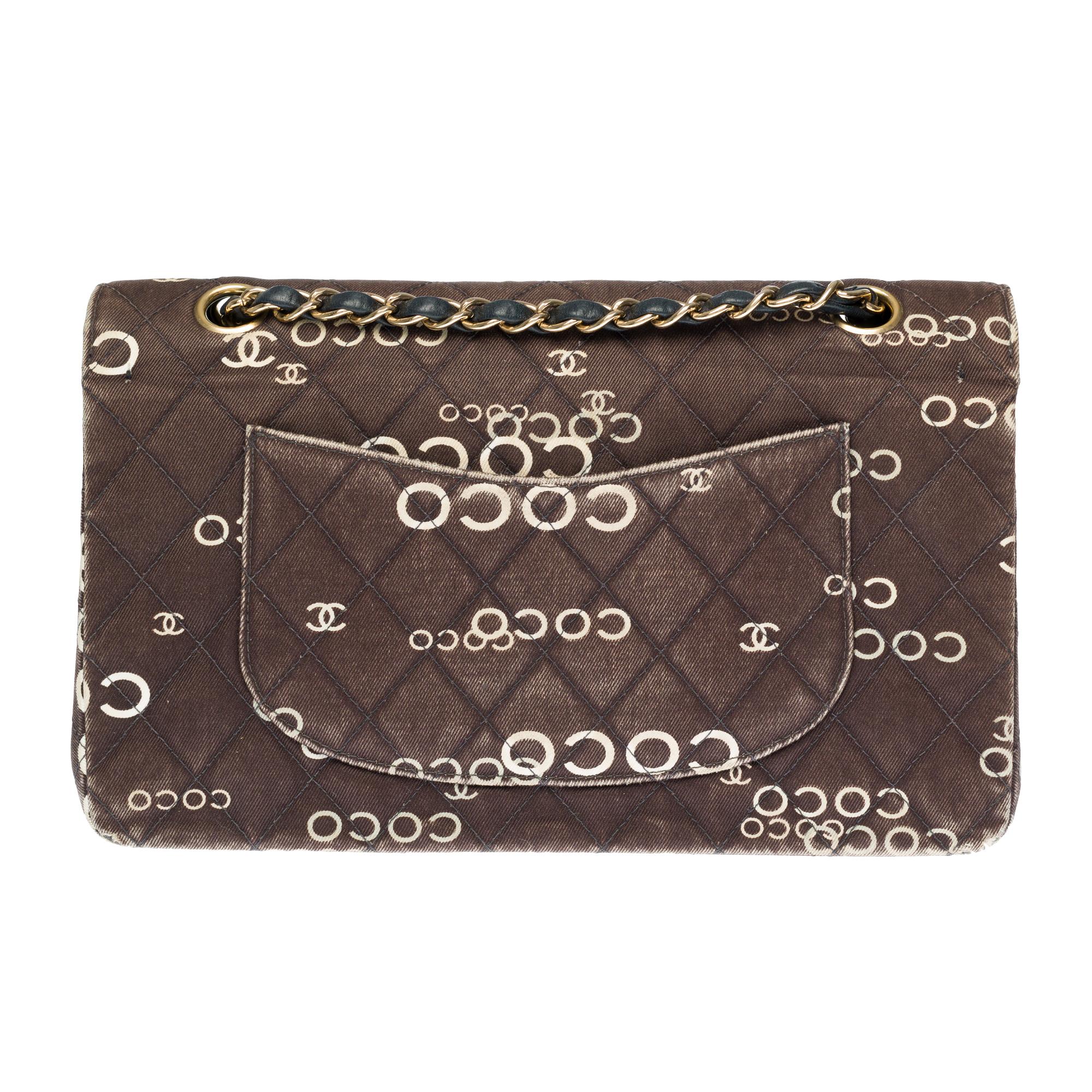 Collector’s Coin/ Limited Edition Coco Chanel

Beautiful Chanel Timeless 2.55 handbag with double flap in brown printed quilted canvas, gold metal hardware, a gold metal chain handle intertwined with black leather allowing a hand or shoulder or