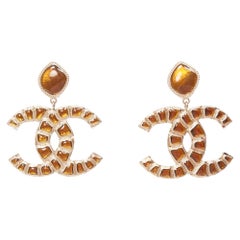 rare CHANEL B19A Along The Nil metal orange gripoix logo clip on earrings Pair