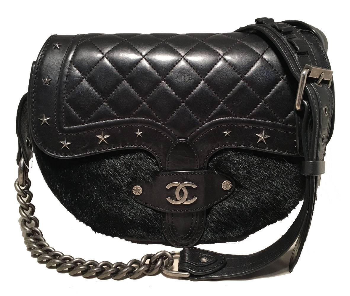 fabulous RARE Chanel Vintage Dallas Studded Saddle Bag in excellent condition.  Black leather exterior trimmed with soft black mink fur and antiqued silver hardware.  Buckled chain and leather shoulder strap can be adjusted and worn cross body