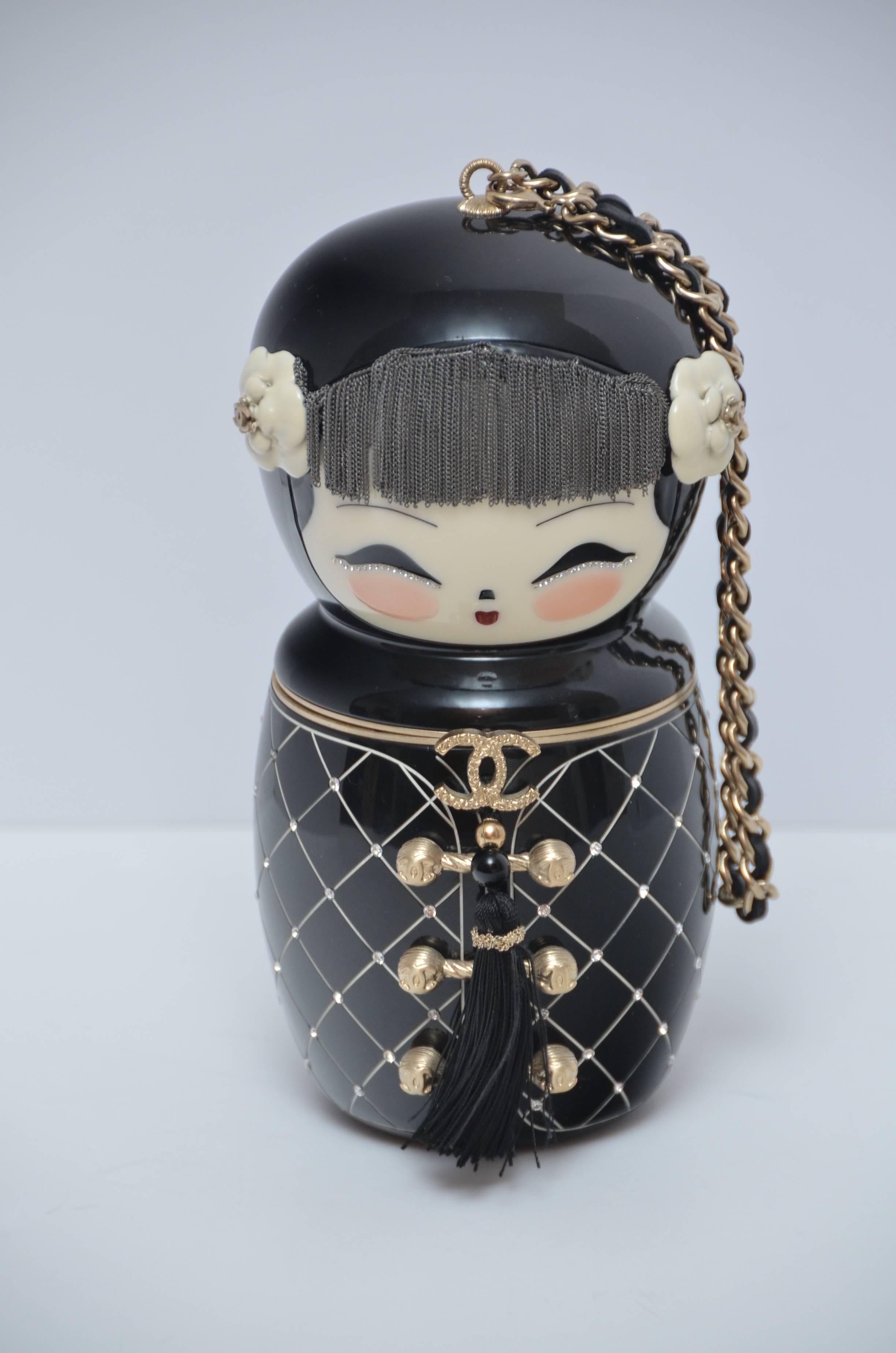Chanel  PARIS-SHANGHAI  Doll Clutch. 
This special bag was  part of Karl Lagerfeld’s handbag collection that was Shanghai oriented. 
His collection shows great Parisian skill making all of them a true French luxury. 
This bag took its inspiration