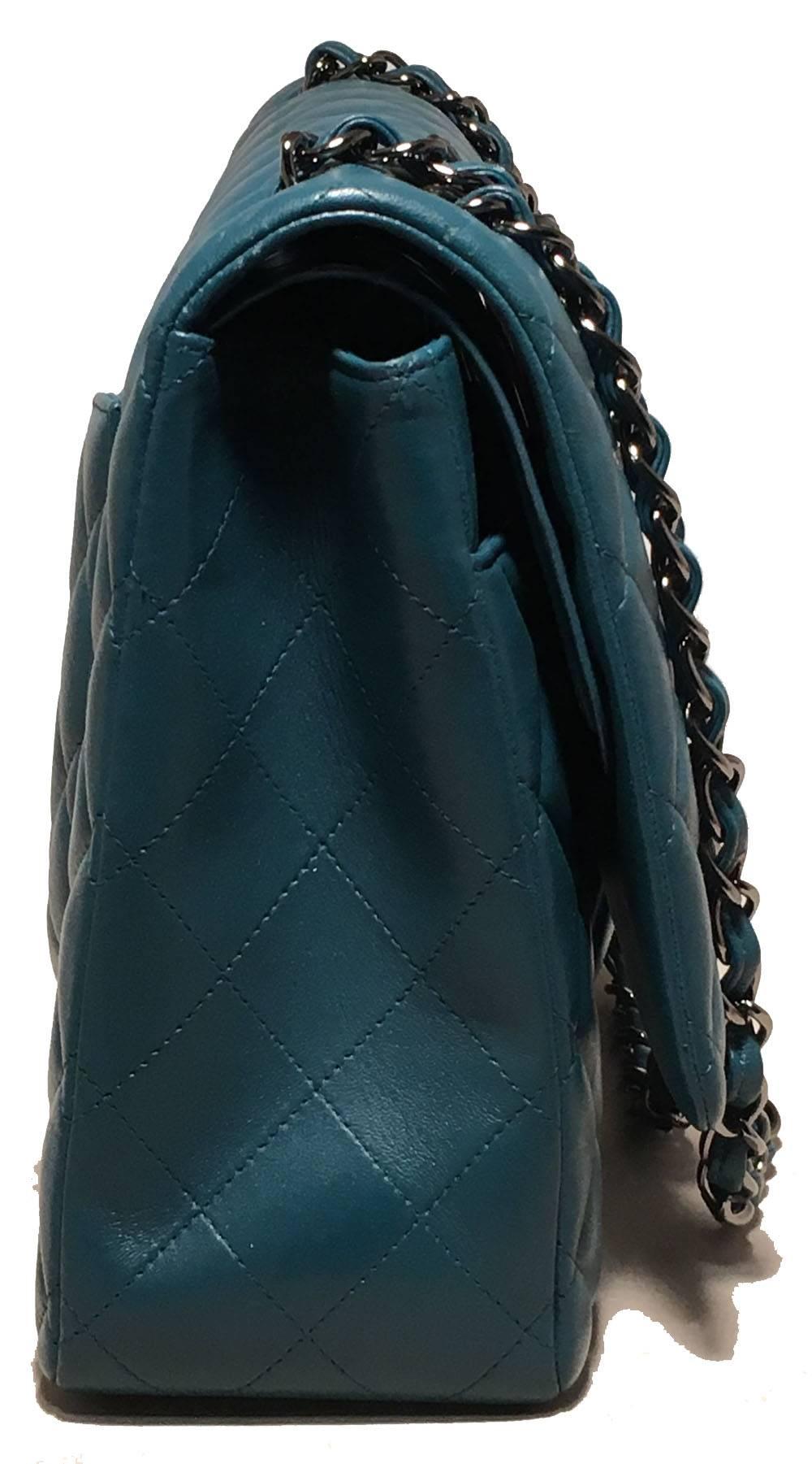 Chanel Dark Teal Quilted Lambskin Leather 2.55 Double Flap Classic Shoulder Bag in excellent condition. Quilted dark teal lambskin leather exterior trimmed with sparkling silver hardware. woven chain and leather shoulder strap can be worn short or