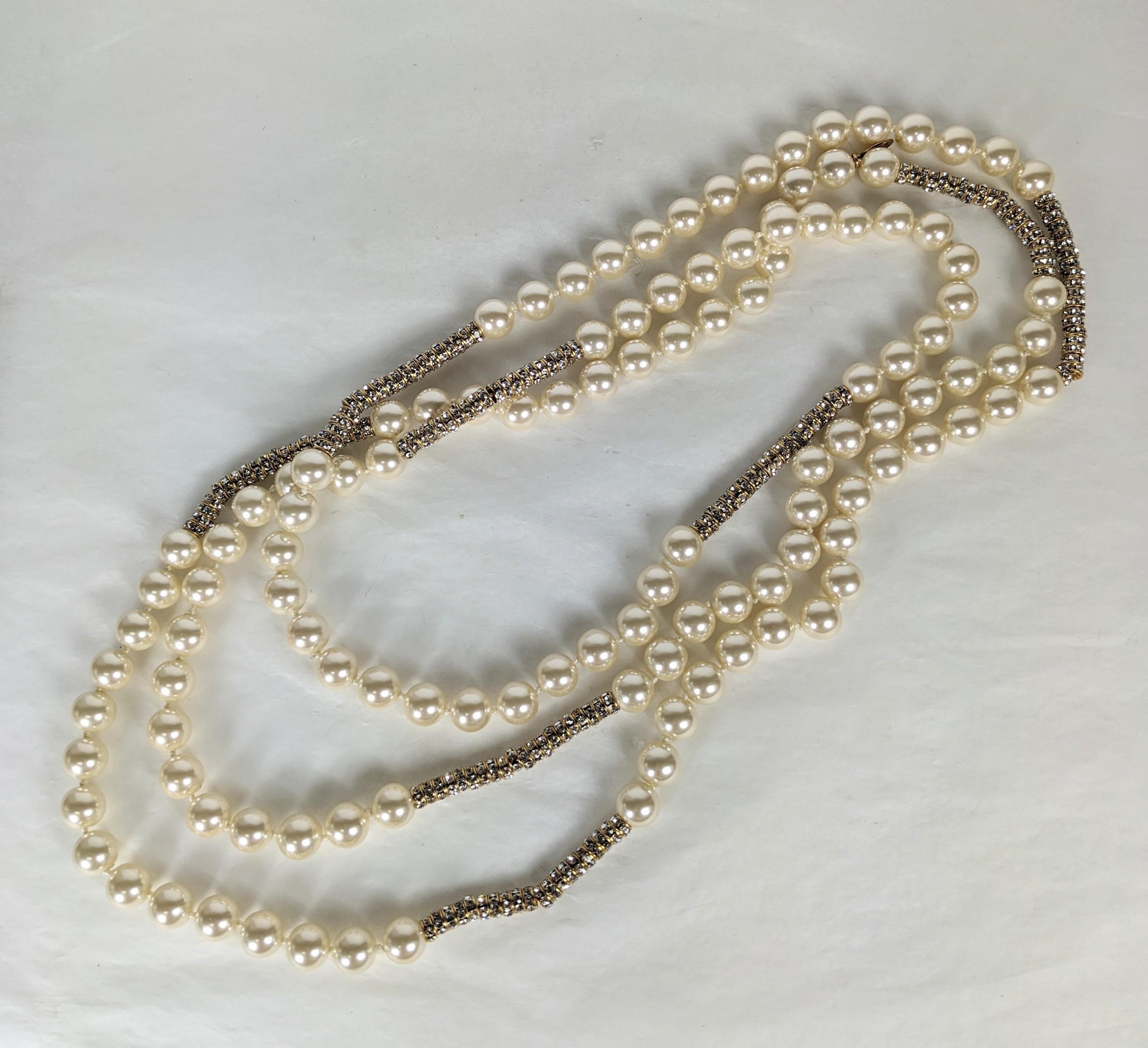 Super Rare and Versatile Chanel Endless Pearl and Crystal Rondel Necklace. Incredibly long and so versatile to wrap or wear singly. Hand knotted faux pearls with gilt bullion caps with hundreds of crystal set rondels. Approx 80