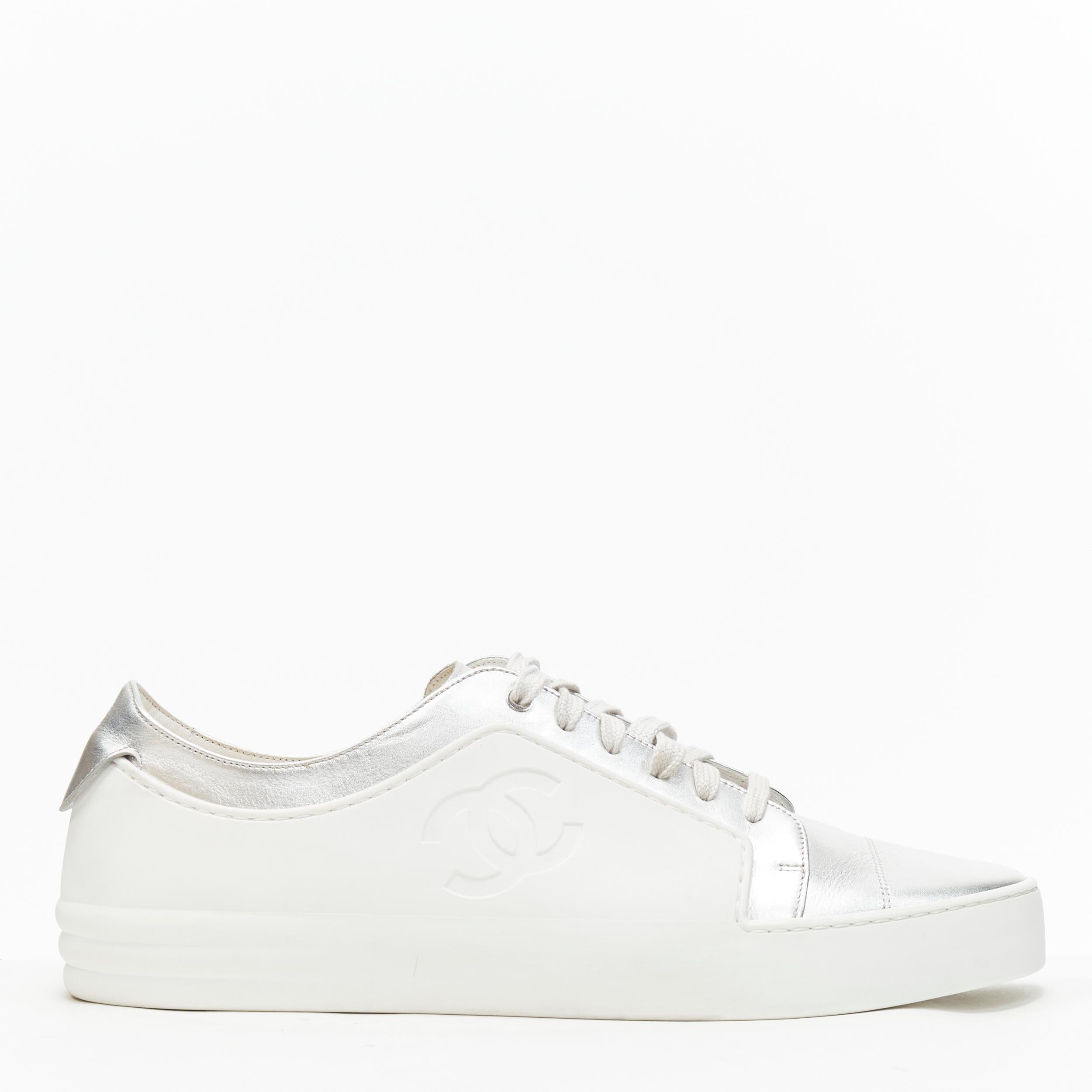 rare CHANEL interlocking CC white rubber metallic silver low top sneaker EU43 Reference: TGAS/B01067 
Brand: Chanel 
Model: CC rubber silver leather sneaker 
Material: Rubber 
Color: White 
Pattern: Solid 
Closure: Lace Up 
Extra Detail: White