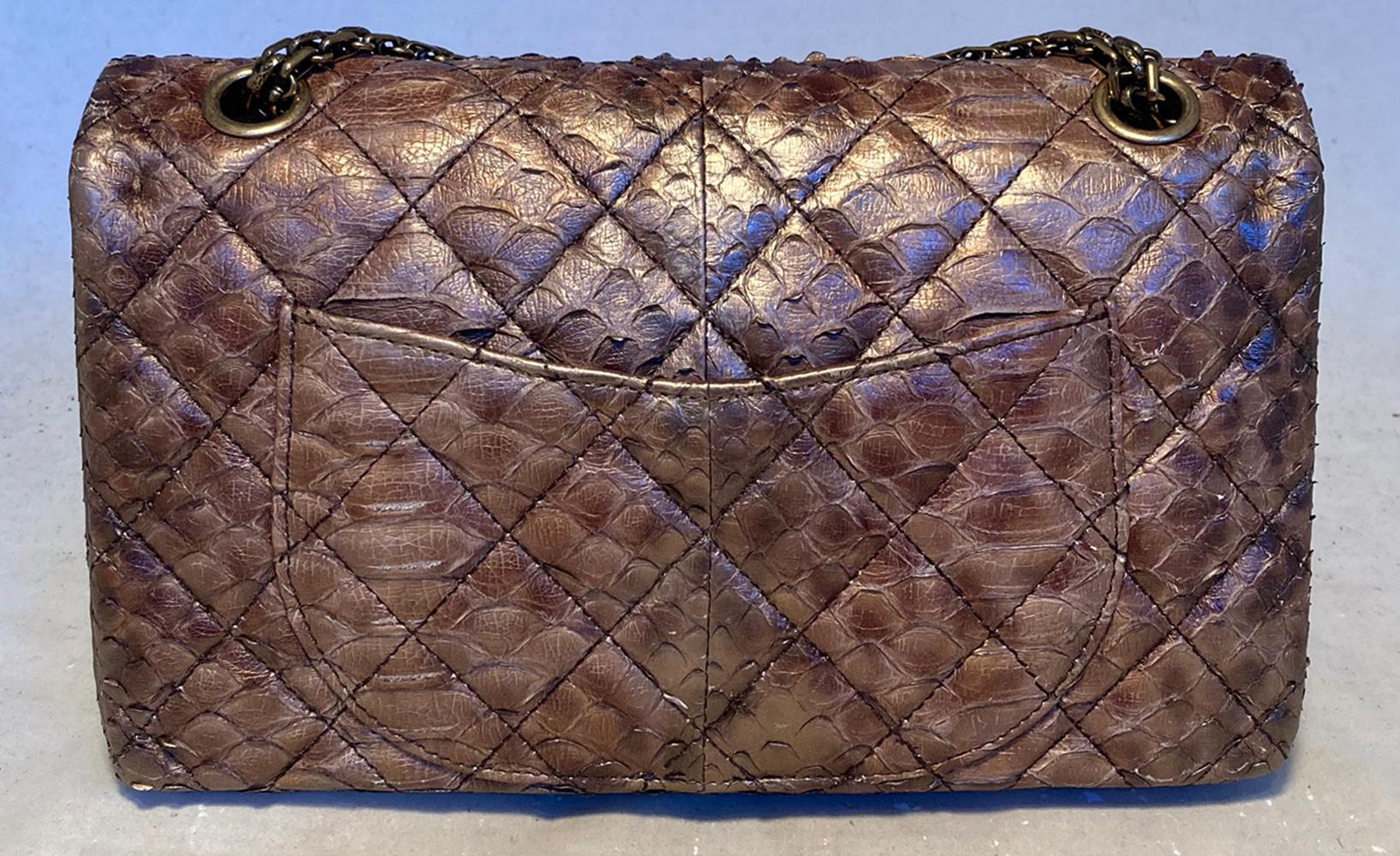 RARE Chanel Metallic Copper Python 2.55 Double Flap Classic in excellent condition. Metallic copper python snakeskin exterior trimmed with bronze hardware. 2 charmes upon the chain shoulder strap, one bronze cat with black enamel stripes and
