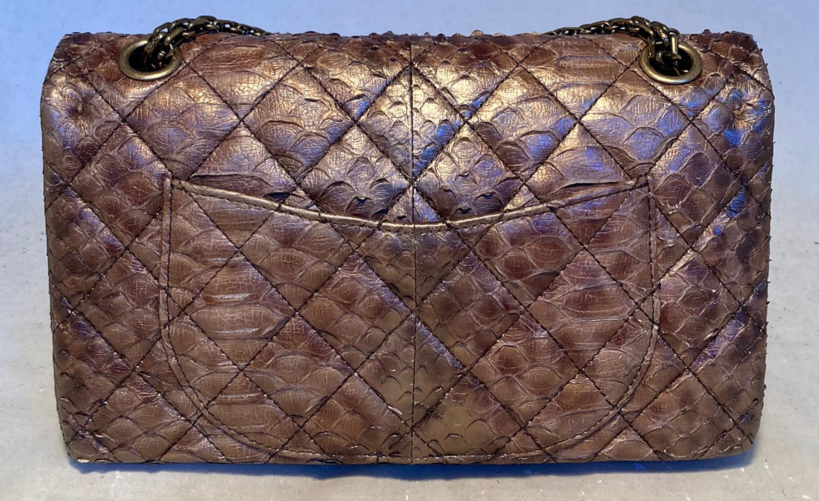 RARE Chanel Metallic Copper Python 2.55 Double Flap Classic in excellent condition. Metallic copper python snakeskin exterior trimmed with bronze hardware. 2 charmes upon the chain shoulder strap, one bronze cat with black enamel stripes and