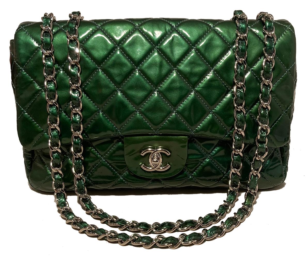 Chanel Metallic Green Patent Leather Jumbo Classic Flap in excellent condition. Metallic green quilted patent leather exterior trimmed with silver hardware and signature woven chain and leather shoulder strap. Front CC logo twist closure opens via