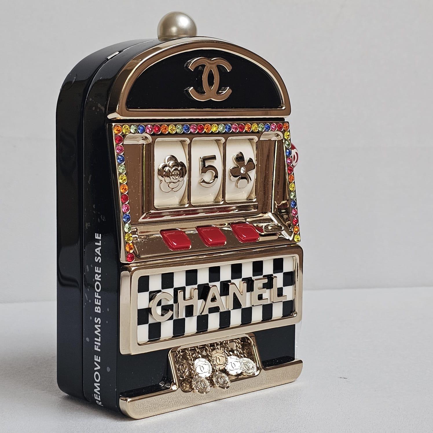 Rare casino slot machine minaudiere. In unused condition with the sticker film still attached. 