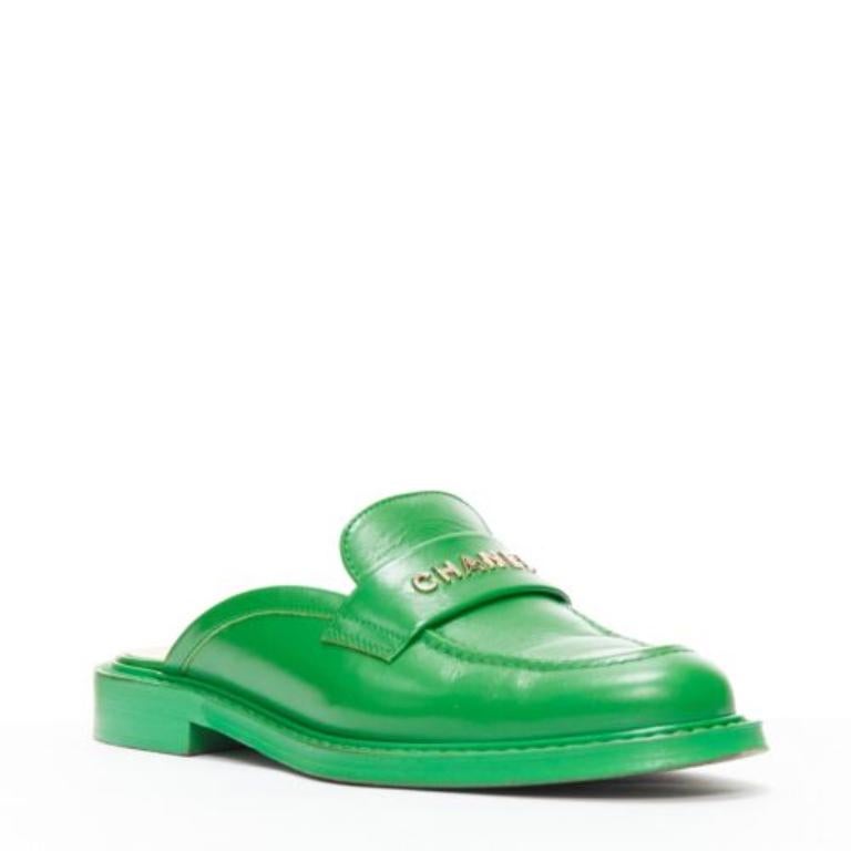 Green rare CHANEL PHARRELL green leather logo embellished slip on loafer flats EU37.5