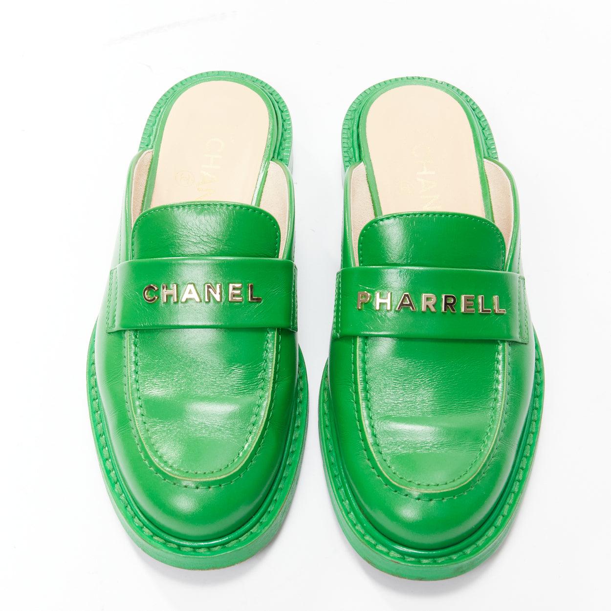 rare CHANEL PHARRELL green leather logo embellished slip on loafer flats EU37.5 In Good Condition For Sale In Hong Kong, NT