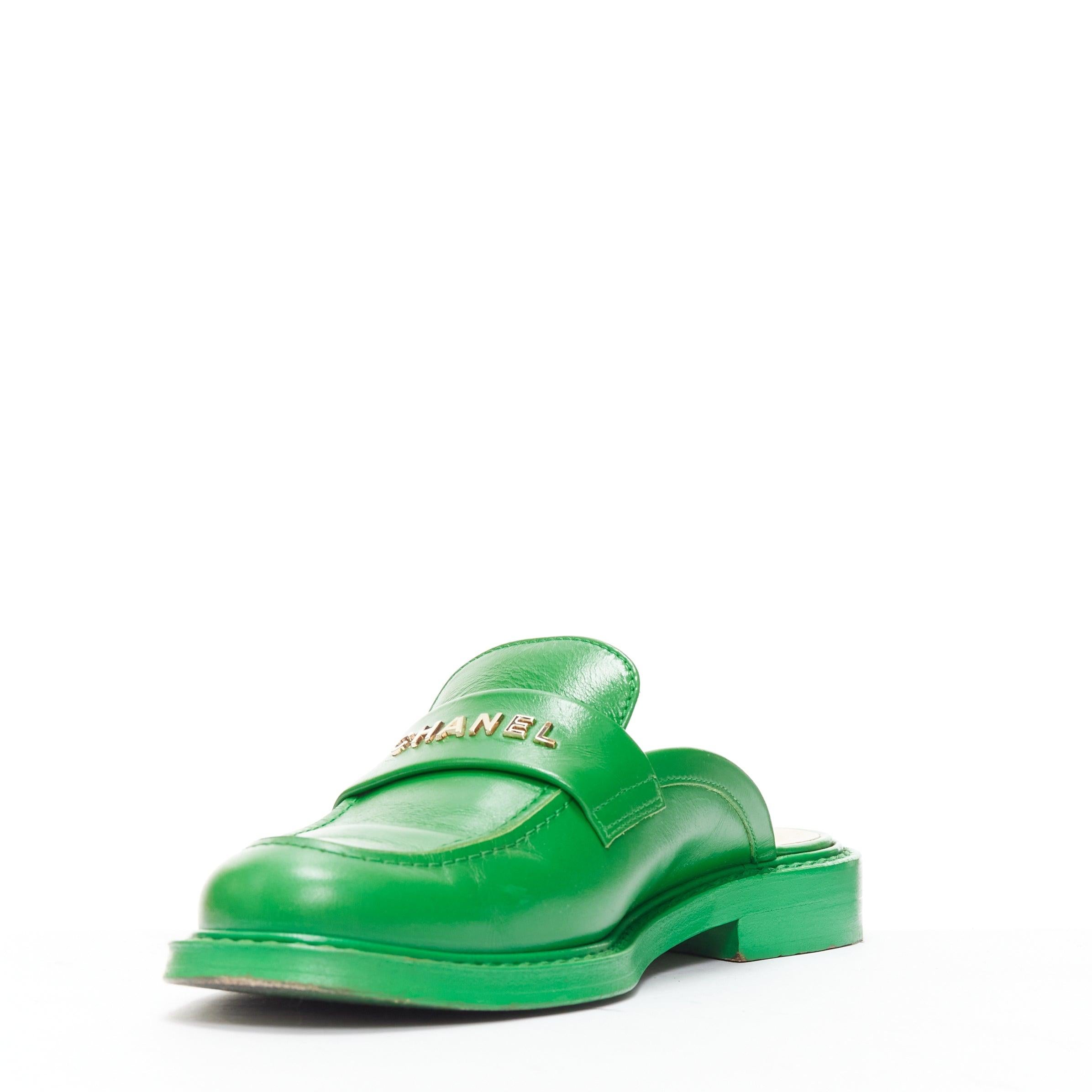 Women's rare CHANEL PHARRELL green leather logo embellished slip on loafer flats EU37.5 For Sale