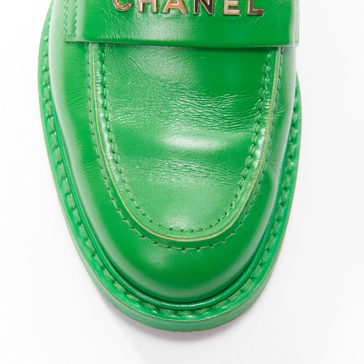 rare CHANEL PHARRELL green leather logo embellished slip on loafer flats EU37.5 For Sale 2
