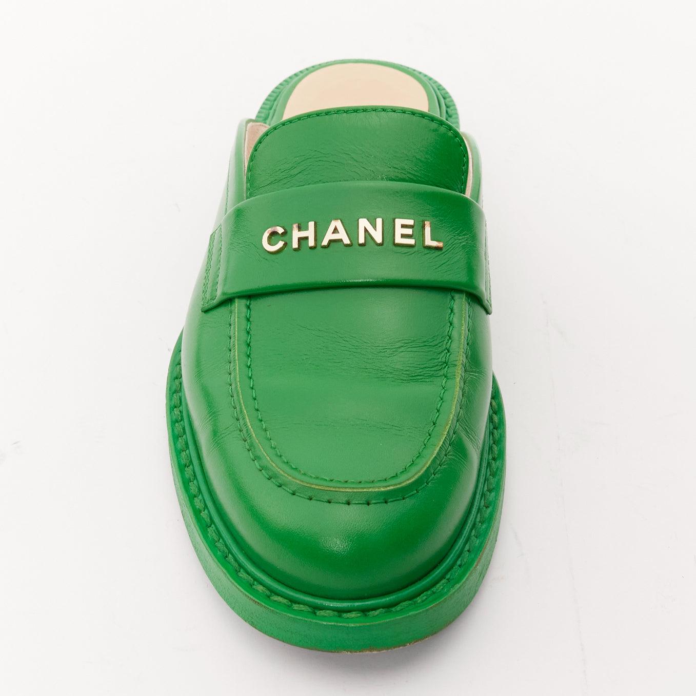 rare CHANEL PHARRELL green leather logo embellished slip on loafer flats EU37.5 For Sale 4