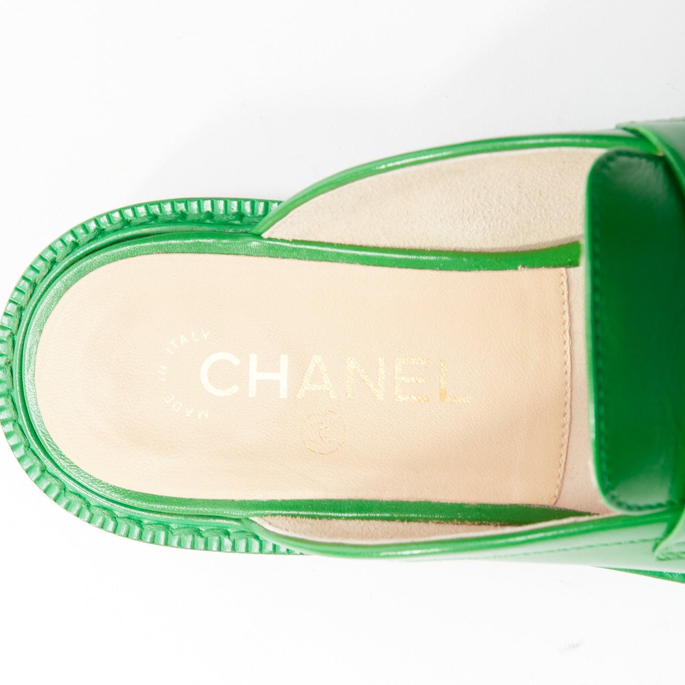 rare CHANEL PHARRELL green leather logo embellished slip on loafer flats EU37.5 For Sale 5