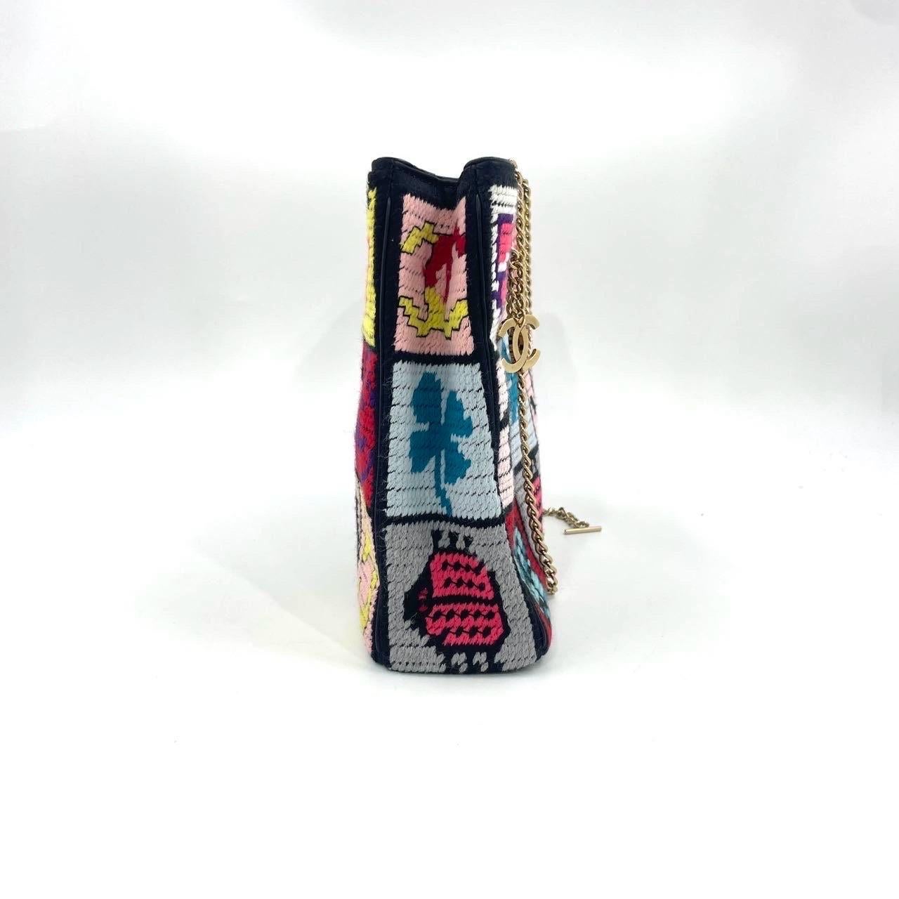 Rare Chanel Precious Symbols Needlepoint Shoulder Bag Shopper Tote
These are professional photos of the actual bag.
  This shoulder bag features a tweed body patchwork with Classic Chanel Icons, gold-tone chain straps, open top, and interior zip