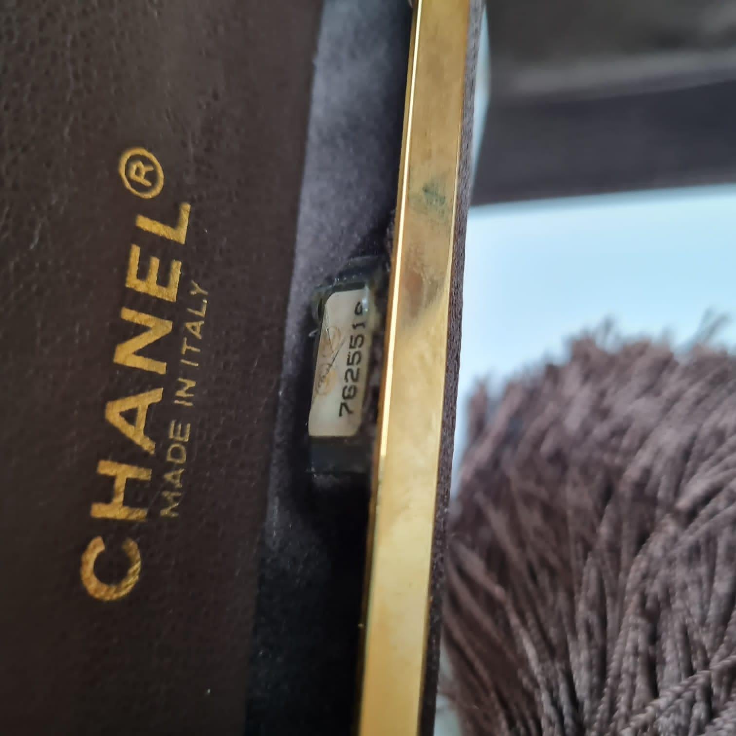 Rare Tortoiseshell Chanel clutch with tassel. Hairline scratches on the surface as seen on pictures. There is a mark on the mirror due to storage. Other than that still in good vintage condition. Beautiful brown satin lining. Series #7. Comes with