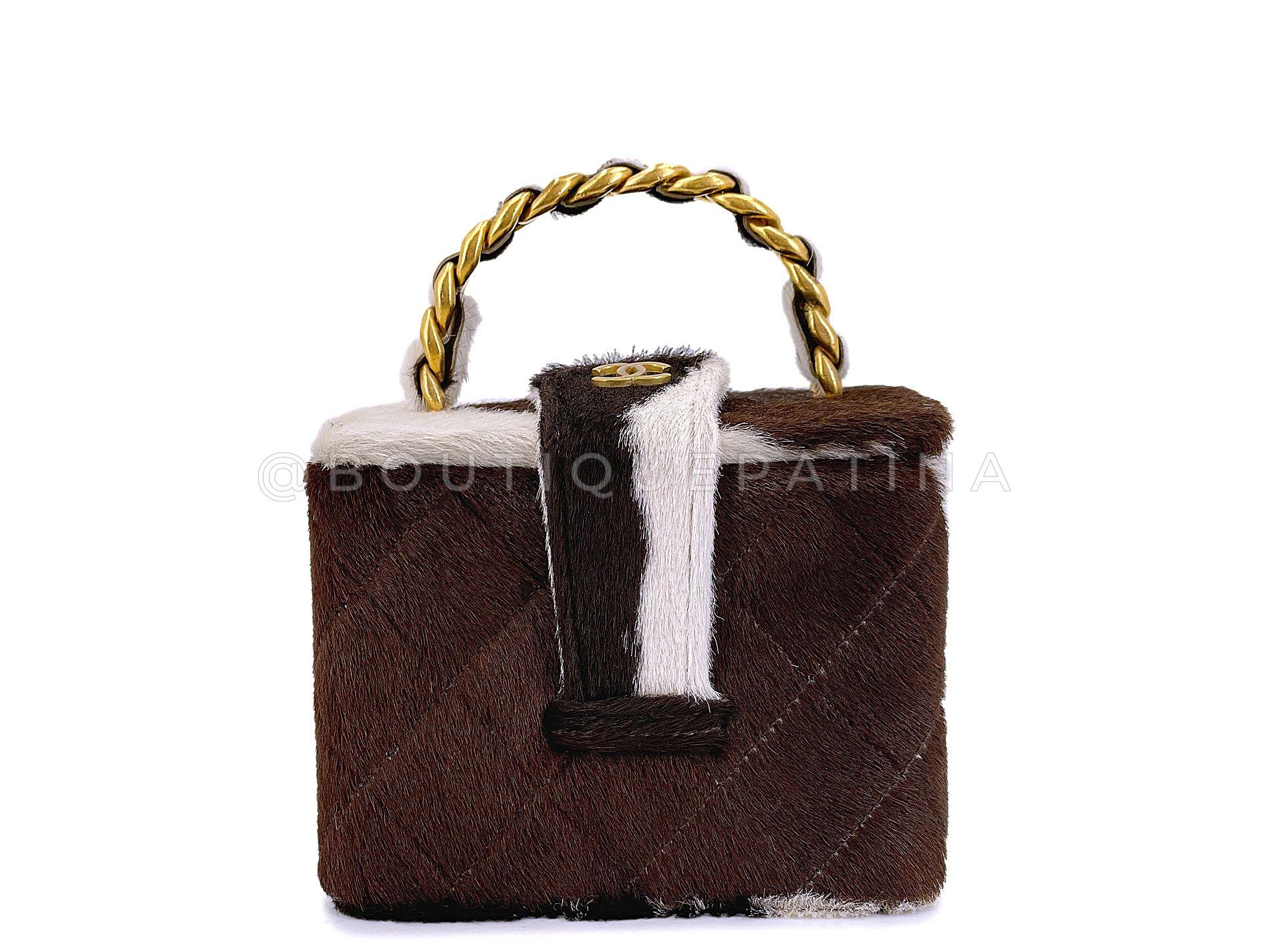 Store item: 67912
This Rare Chanel Vintage Cow Print Pony Hair Mini Cube Vanity Case Bag is a collector's holy grail. This is a vintage classic. Produced in 1995, almost 30 years old and in stunning condition.

A small cube-shaped vanity made of