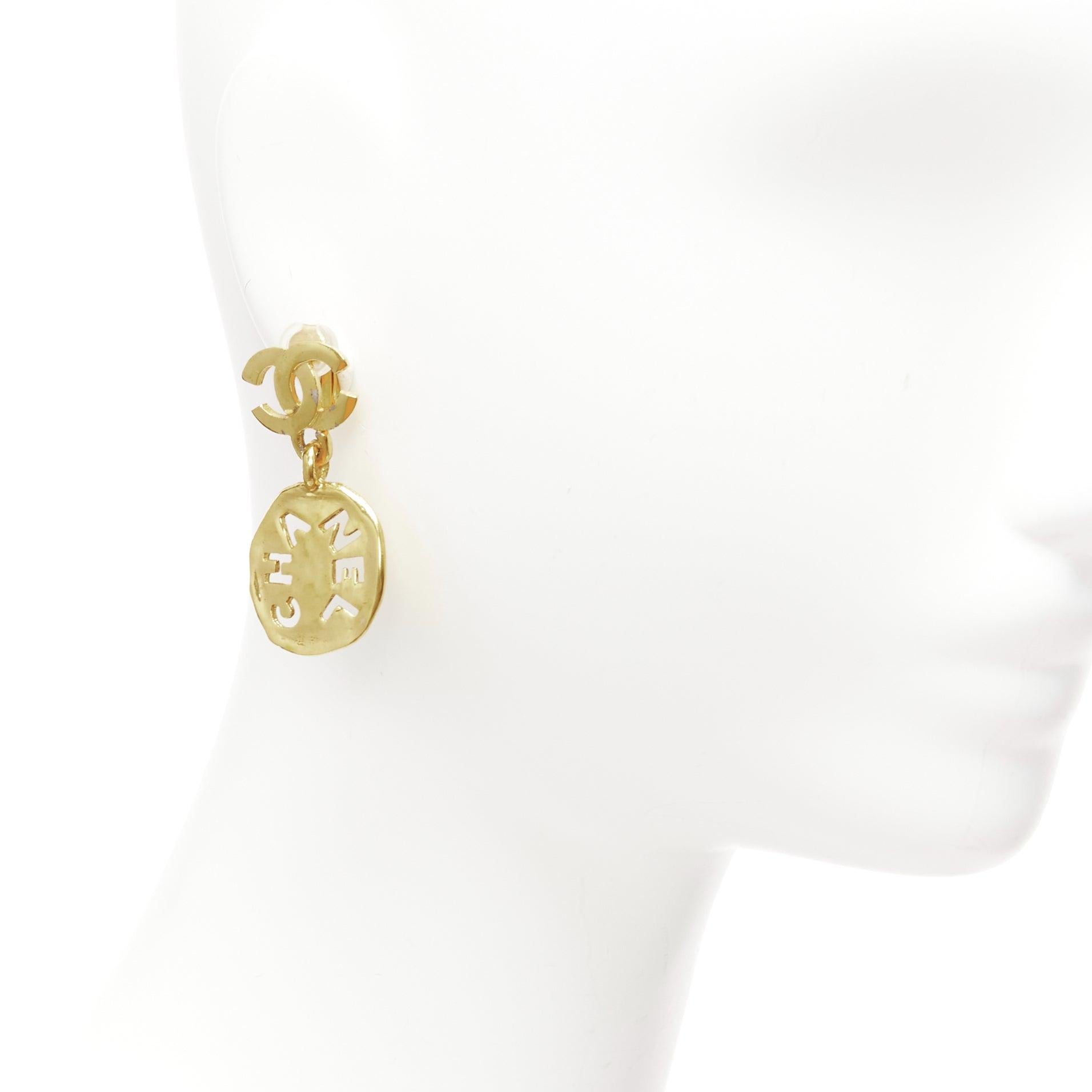 rare CHANEL Vintage gold CC logo cut out hammered coin clip on earrings
Reference: TGAS/D00905
Brand: Chanel
Designer: Karl Lagerfeld
Material: Metal
Color: Gold
Pattern: Solid
Closure: Clip On
Lining: Gold Metal

CONDITION:
Condition: Good, this