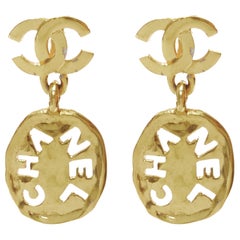 rare CHANEL Vintage gold CC logo cut out hammered coin clip on earrings