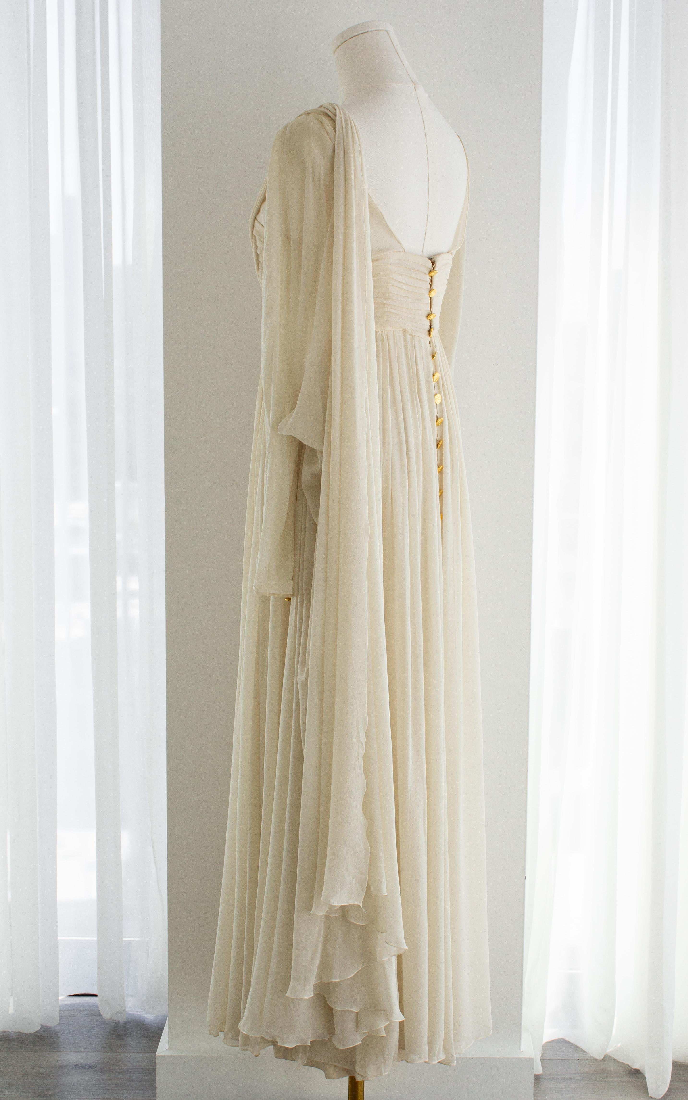 An ethereal and rare Chanel creation from the Spring/Summer 1989 collection, designed under Karl Lagerfeld’s direction. This gown embodies timeless elegance, drawing inspiration from classical Grecian drapery while retaining the modern refinement of