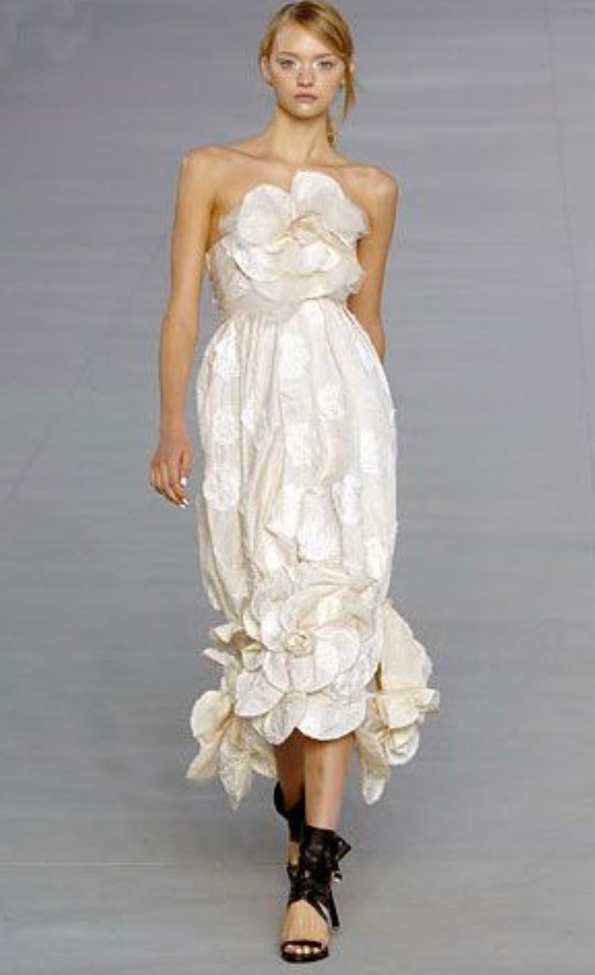 This rare and romantic Chanel Camellia bag is from the Spring 2006 collection. Designed to match the final look of the show—a breathtaking cream camellia gown, also seen on Marissa (Mischa Barton) in The O.C.—this bag is a true collector’s piece,