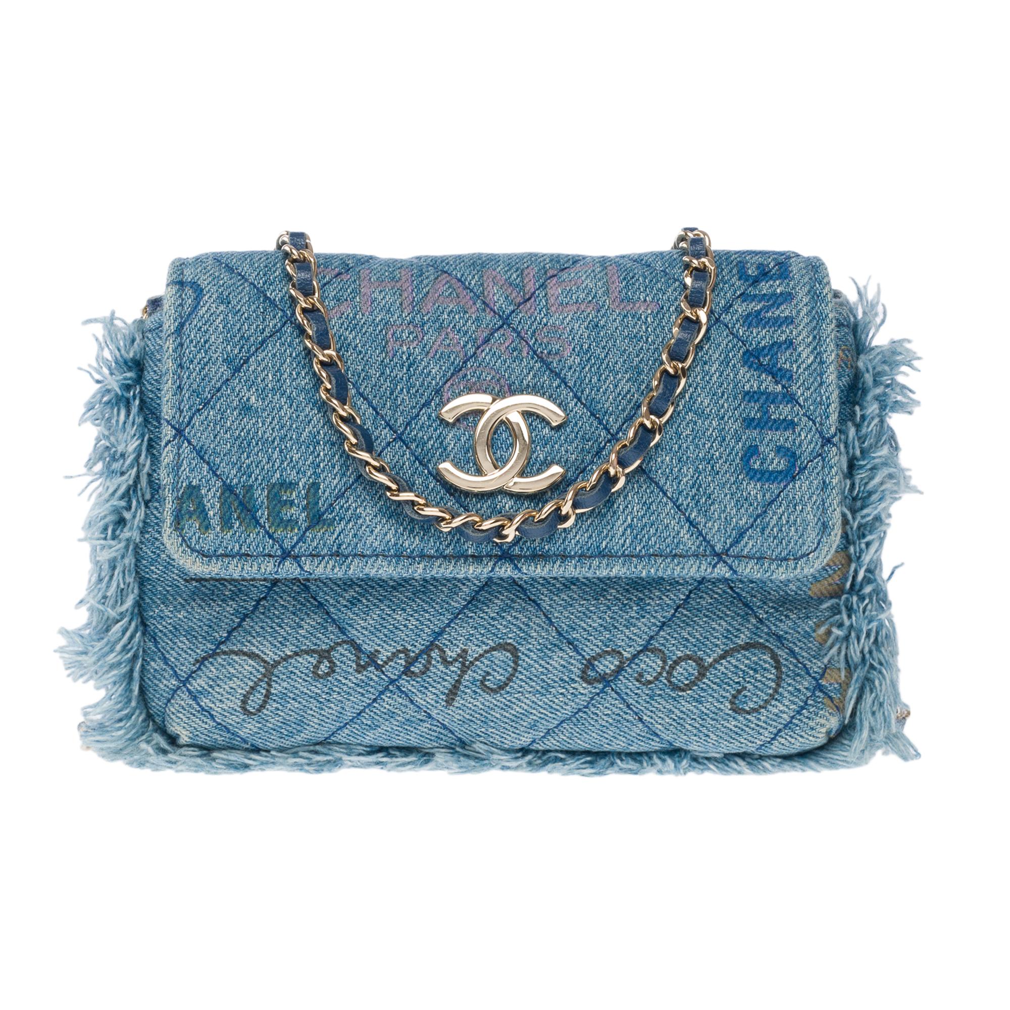 Rare​ ​&​ ​Limited​ ​edition​ ​Chanel​ ​Wallet​ ​On​ ​Chain​ ​(WOC)​ ​in​ ​blue​ ​quilted​ ​denim​ ​with​ ​fringe​ ​on​ ​edge,​ ​silver​ ​metal​ ​trim,​ ​one​ ​handle-silver​ ​metal​ ​chain​ ​interlaced​ ​with​ ​blue​ ​leather​ ​for​ ​shoulder​ ​or​