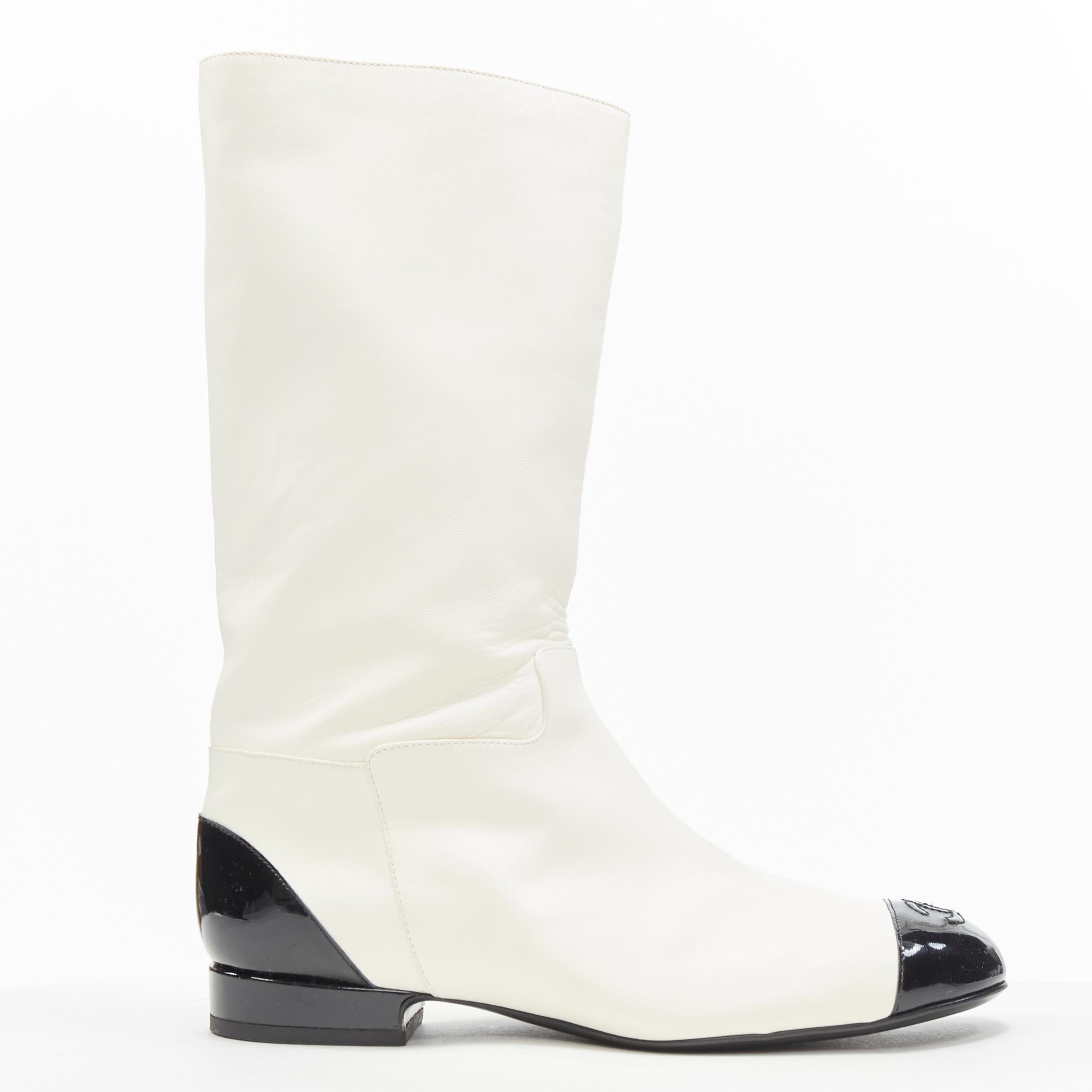 rare CHANEL white soft leather CC logo patent toe cap pull on flat boots EU38 
Reference: CAWG/A00170 
Brand: Chanel 
Designer: Karl Lagerfeld 
Material: Leather 
Color: White 
Pattern: Solid 
Closure: Pull on 
Extra Detail: Soft supple white
