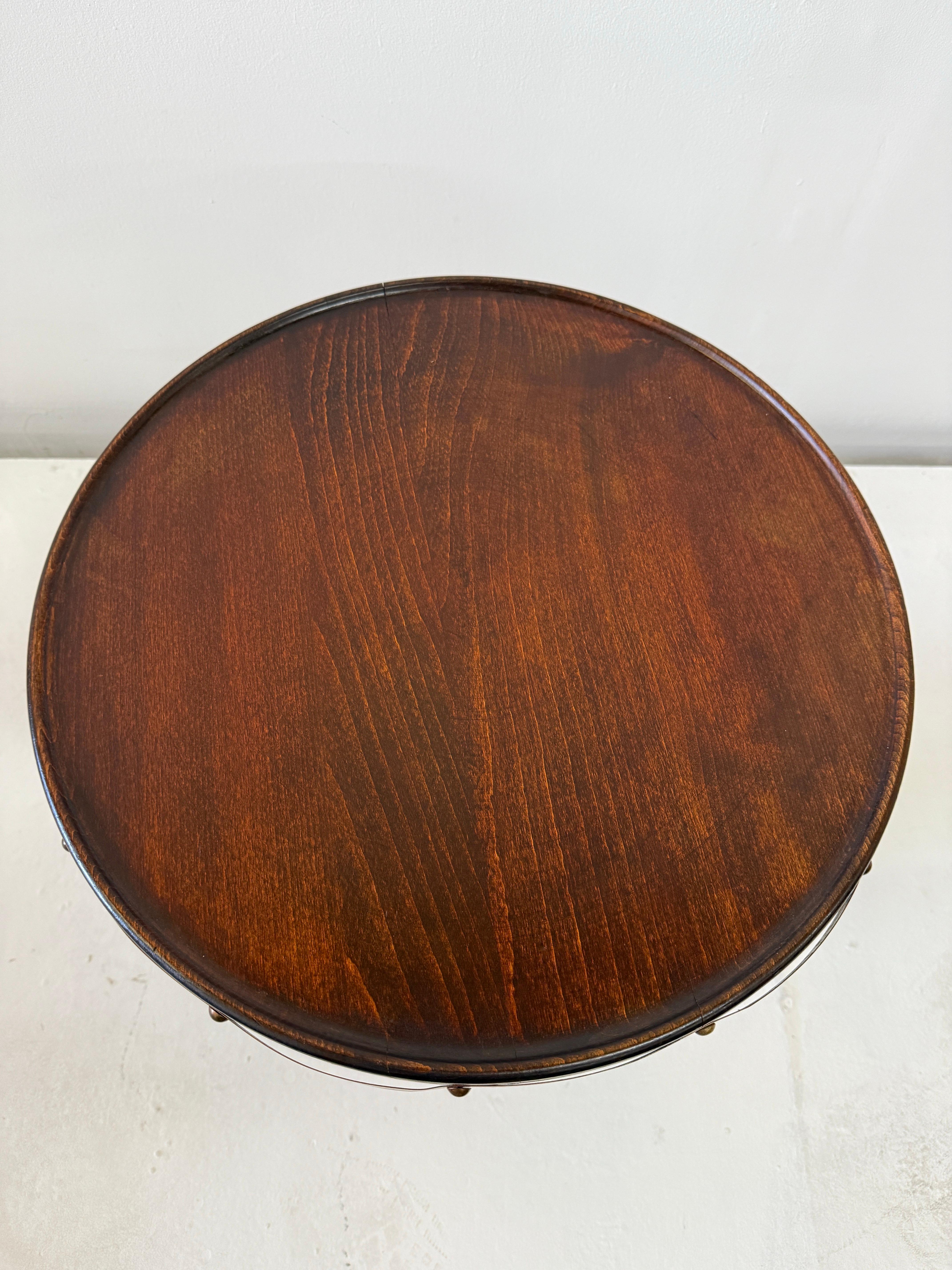 Charles Dudouyt walnut corkscrew style table with copper strap trim details.  France, circa 1940's
This wonderful table is all about the details, hand crafted artisanal piece, lovely wood grain detail.  A beautifully sculpted turned wood corkscrew