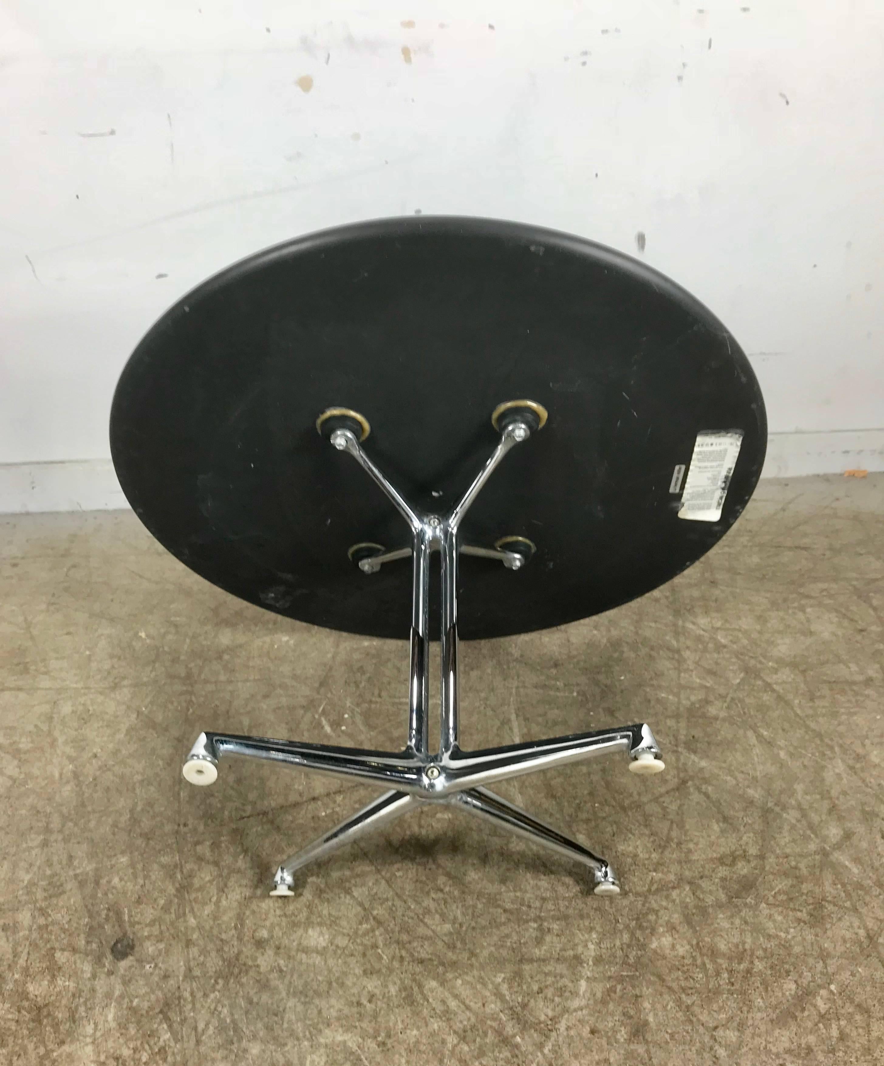 Charles and Ray Eames La Fonda table with slate top made by Herman Miller. Retains original Herman Miller label as well as marble and granite care instructions.