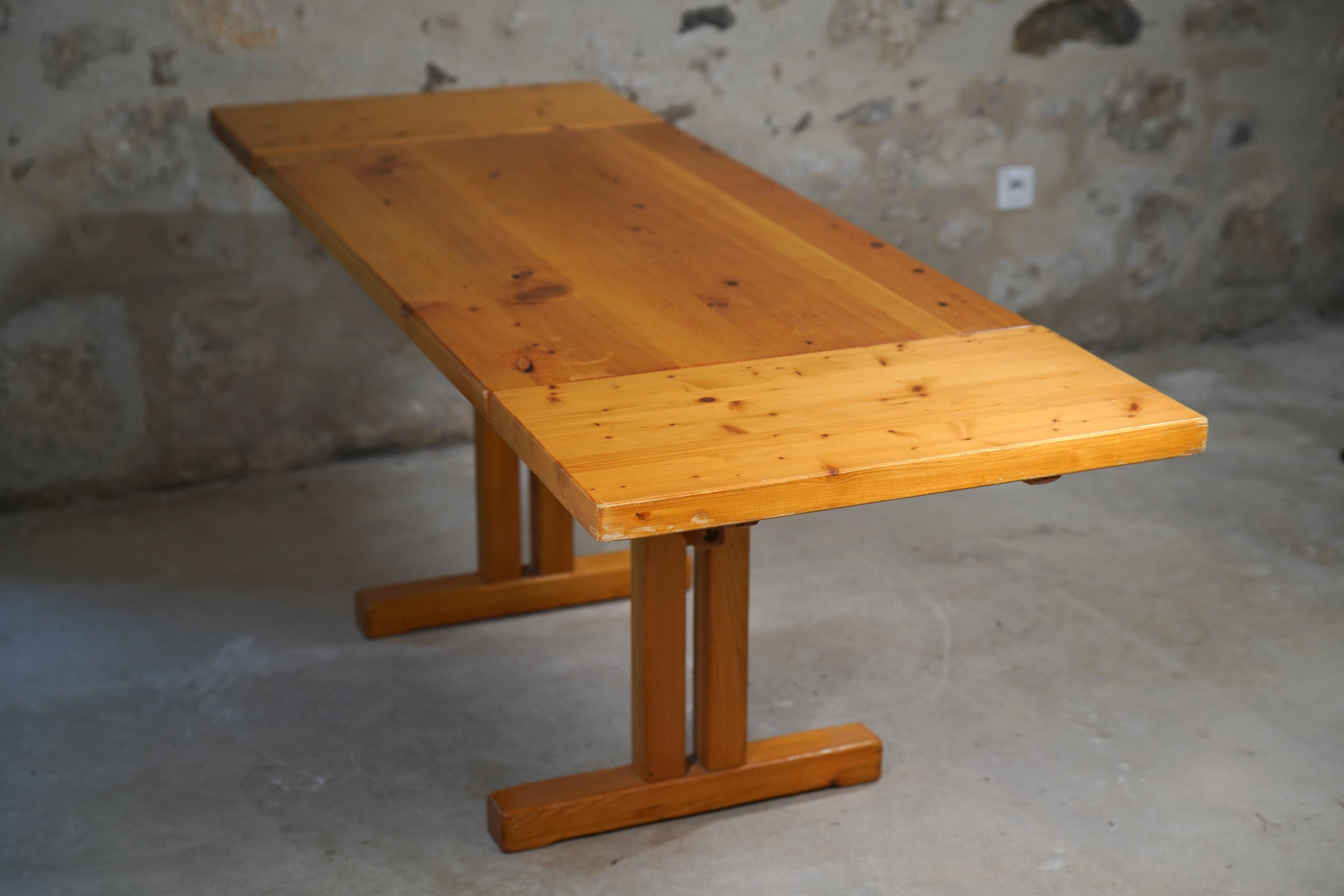 Incredibly rare drop leaf dining table designed by acclaimed architect and designer Charlotte Perriand for the ski resort Les Arcs in Savoie, France in the 1970s.

Very seldom do you see the Perriand Les Arcs dining tables with drop leafs, making