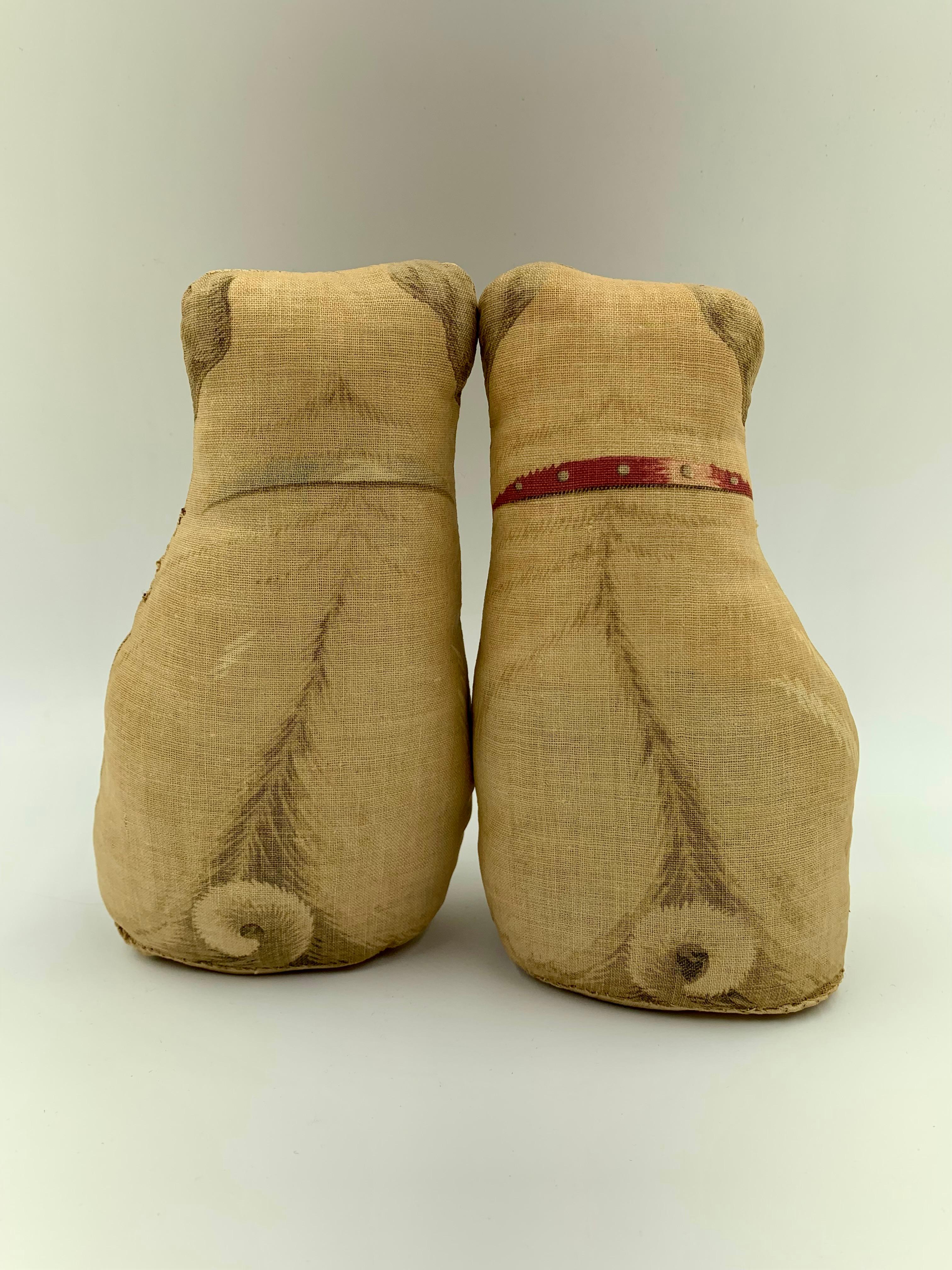Adorable pair of early 20th century printed cotton pug pillows nearly identical to a pair from the collection of Duke and Duchess of Windsor Sotheby's auction, September 11-19, 1997
Comprised of a male pug with a red collar and a female pug with a