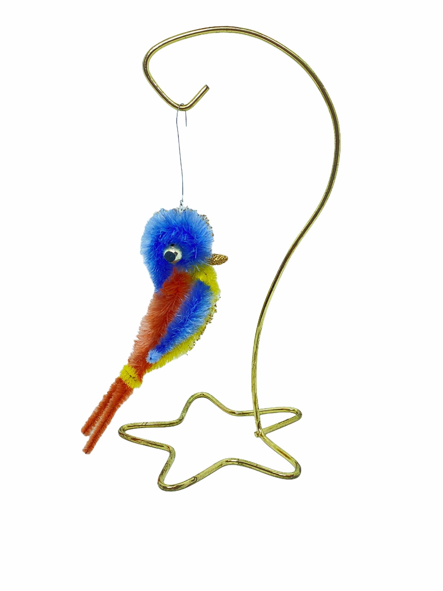 A rare Christmas ornament. It was made from Chenille, wire and glass, this would be a great antique addition for your Christmas or feather tree.
Measurements given are for the bird ornament itself (not including the wire). Stand is not included in