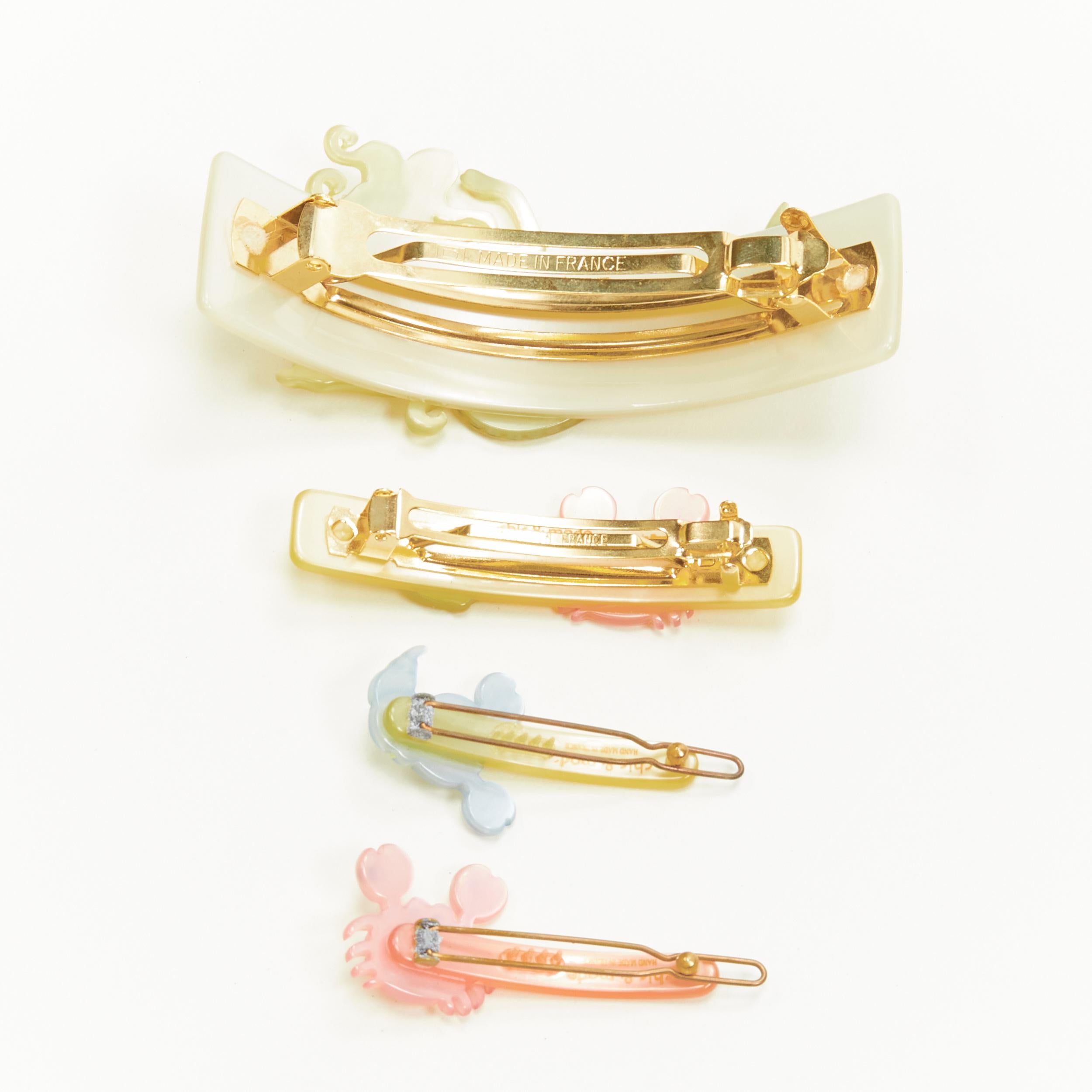 rare CHIC & MODE Alexandre Zouari pastel yellow Mermaid crab hair clips X4 
Reference: ANWU/A00236 
Brand: Chic and Mode
Designer: Alexandre Zouari 
Material: Plastic 
Color: Yellow 
Extra Detail: 10cm Mermaid clip. 7cm fish and crab clip. 6cm